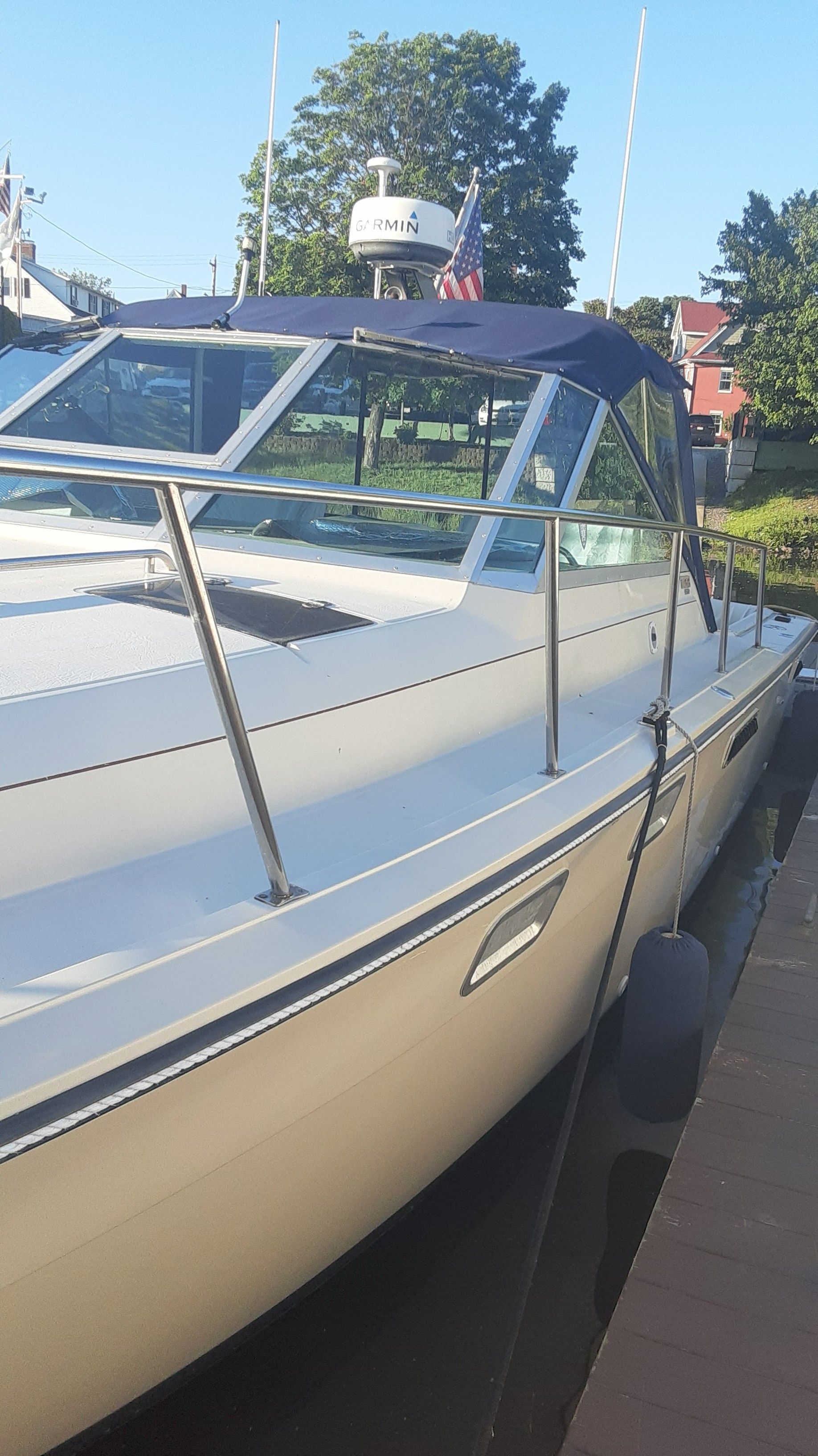 1985 Tiara Yachts 3100 Open docked, side view.