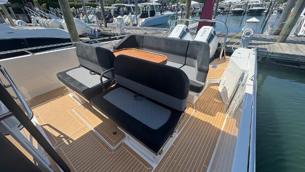 Luxury Nimbus T11 2025 boat with spacious seating and elegant deck design at marina.