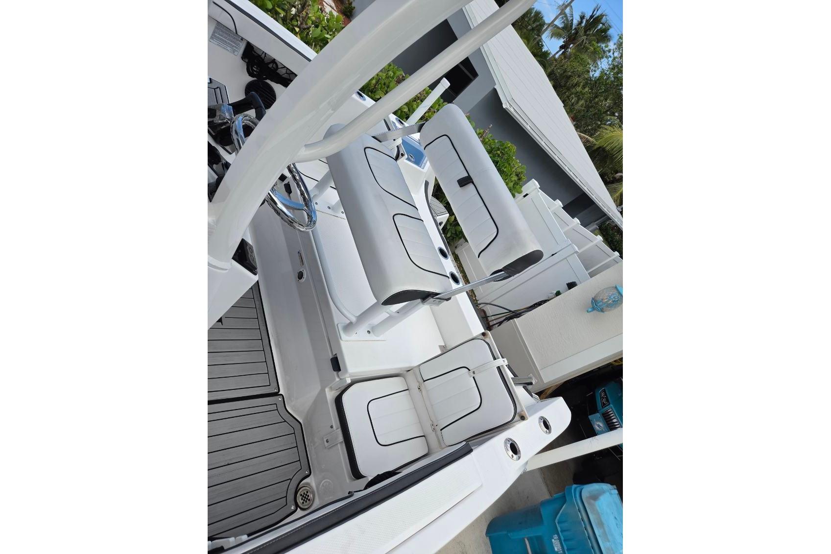 2024 Yamaha Boats 222 FSH Sport E interior with sleek seating and modern design.