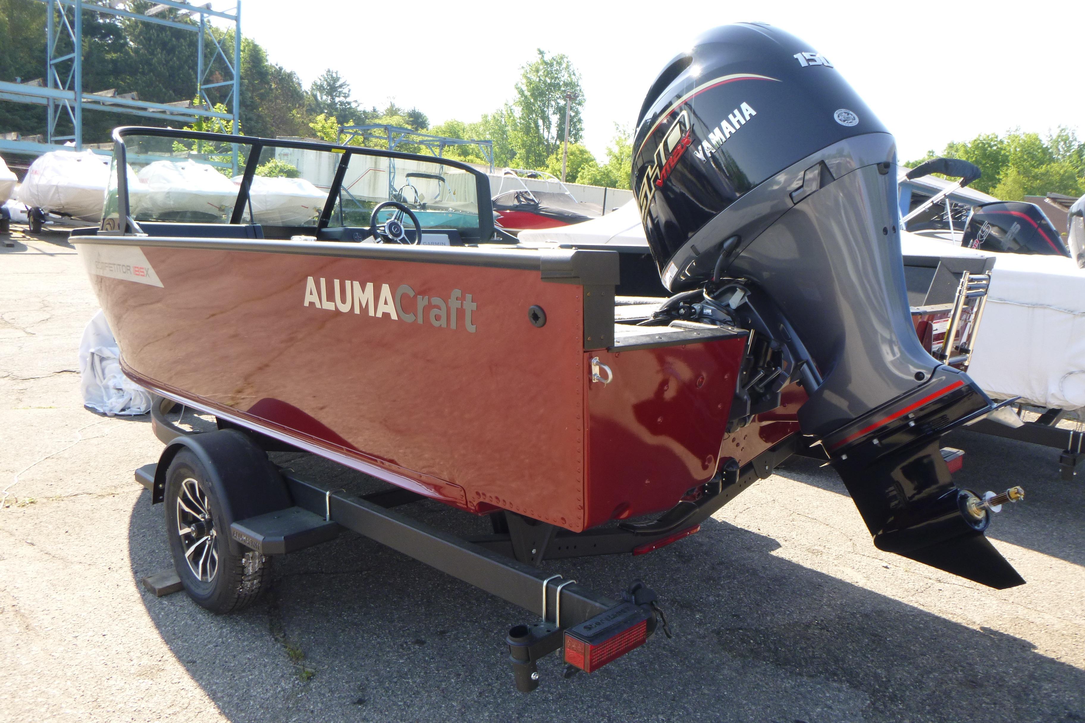 2024 Alumacraft Competitor 185X Sport boat with Yamaha outboard motor on trailer.