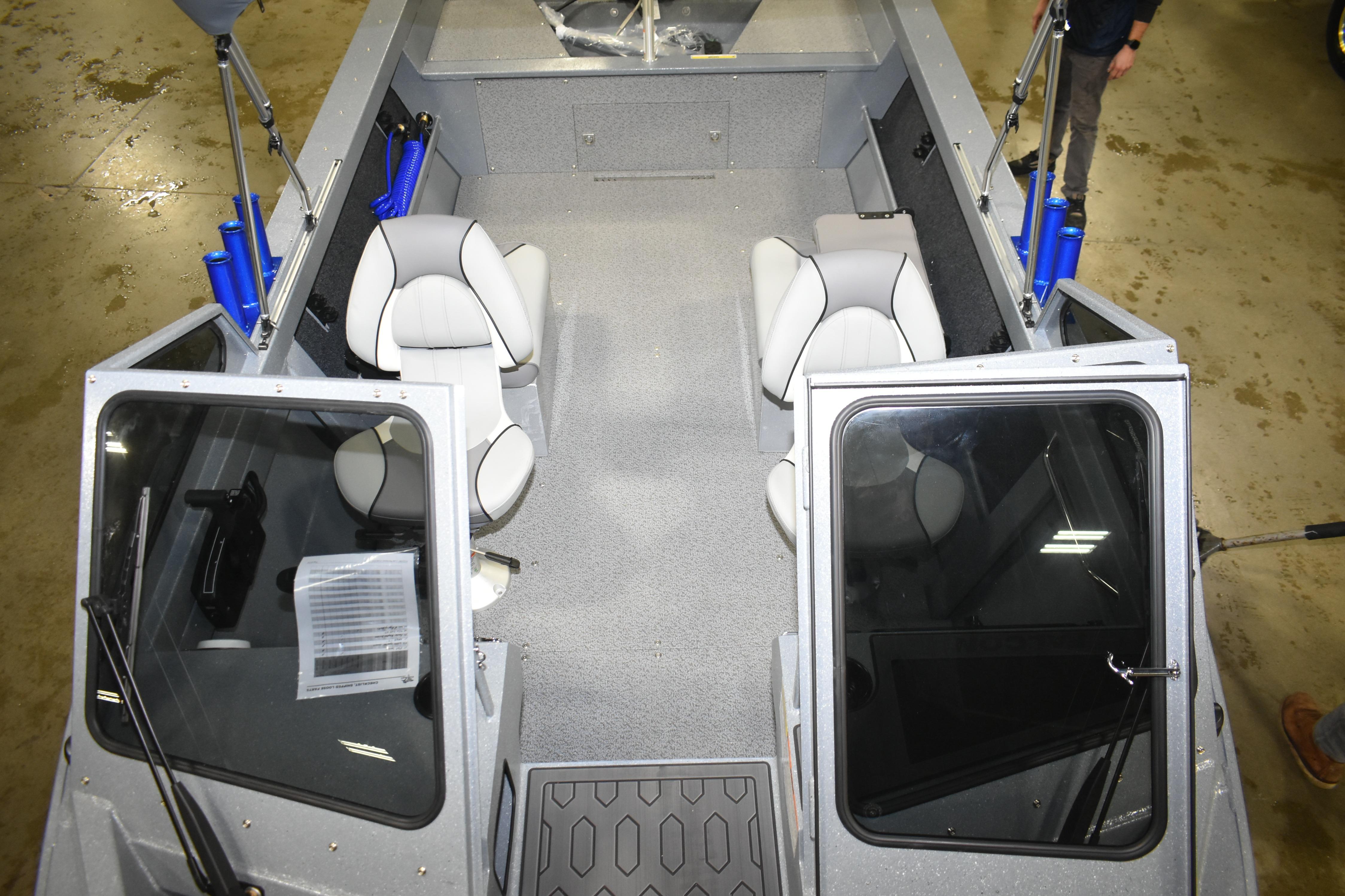 Interior view of 2026 KingFisher 1825 Falcon boat with seating and open doors.