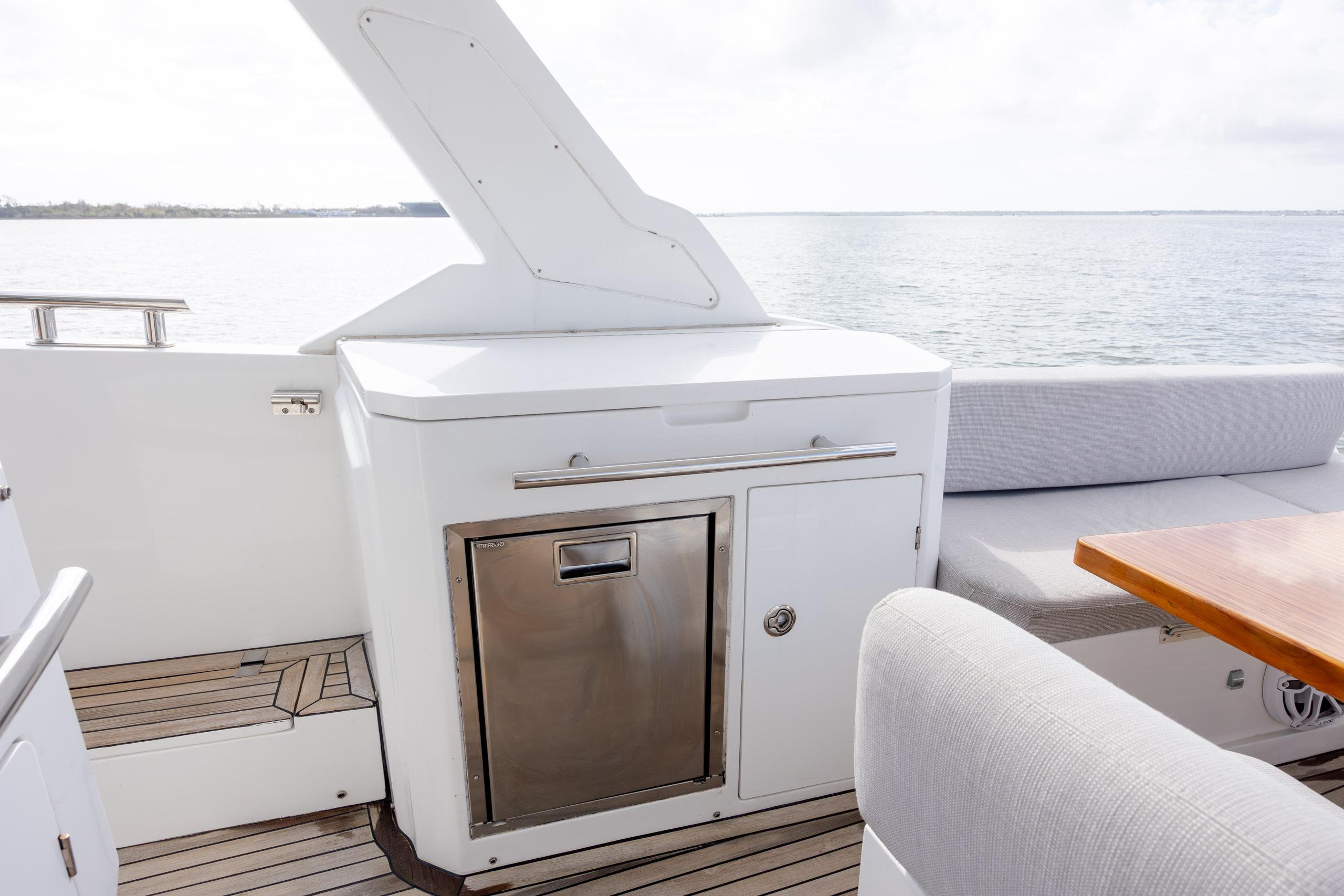 2019 Azimut Verve 40 yacht deck with seating and storage, overlooking serene waters.