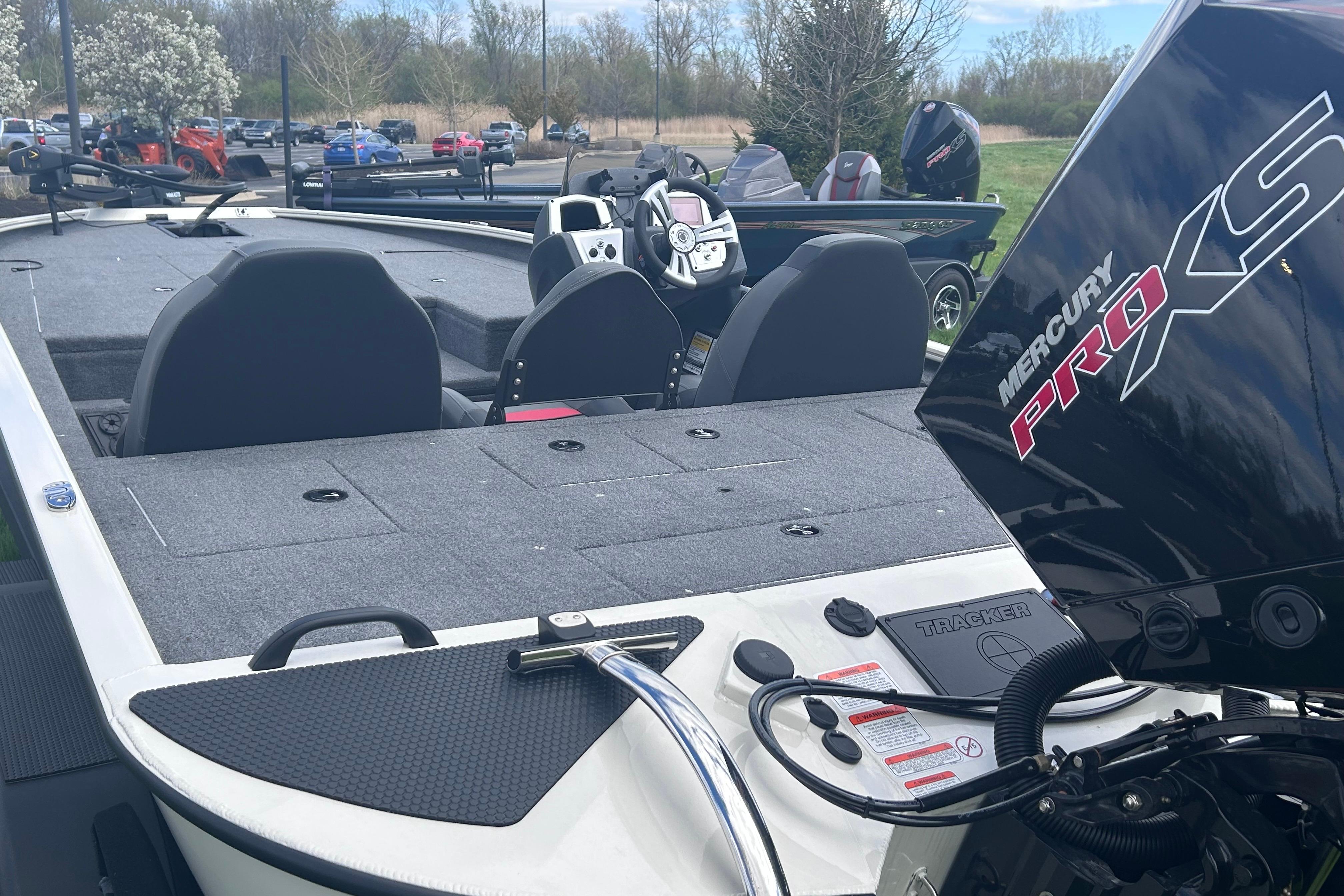 2025 Tracker Savage 215 boat with Mercury Pro XS engine, featuring spacious seating and modern controls.