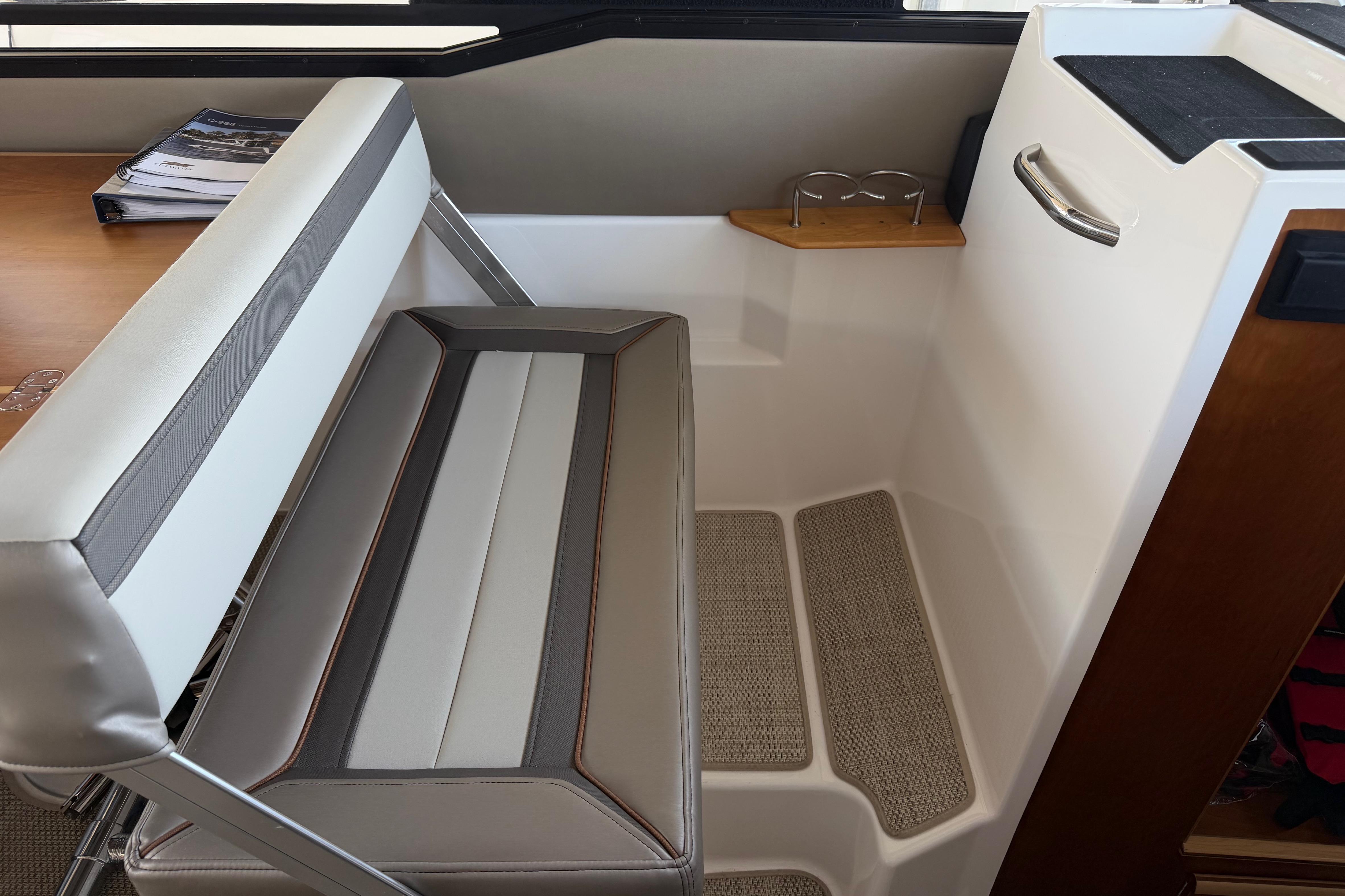 Interior seating area of 2023 Cutwater C-288 Coupe, featuring modern design and comfortable upholstery.
