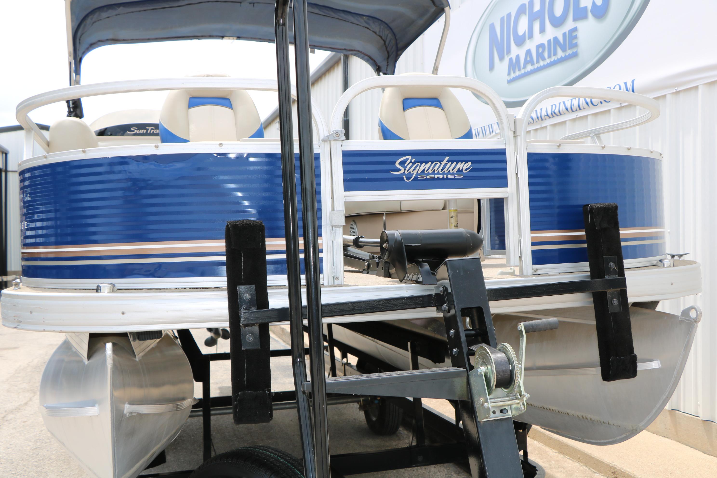 2013 Sun Tracker Fishin' Barge 20 DLX pontoon boat on trailer at Nichols Marine.