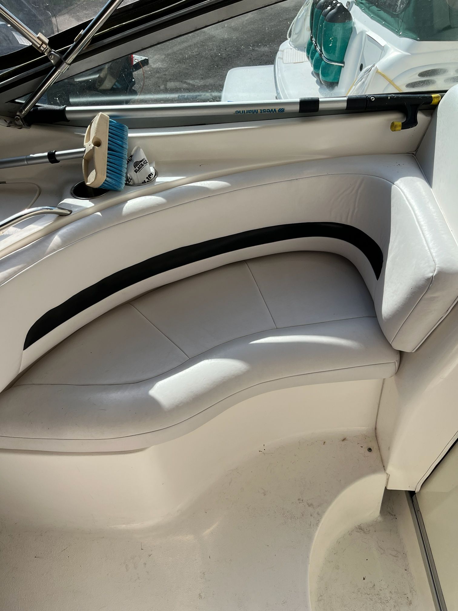 Interior of a 2000 Chaparral Signature with white seating area.