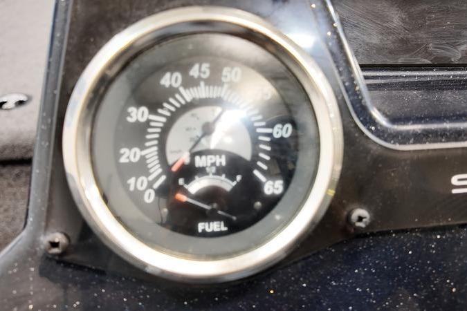 Speedometer and fuel gauge of 2024 Lowe Stinger 198 boat dashboard.