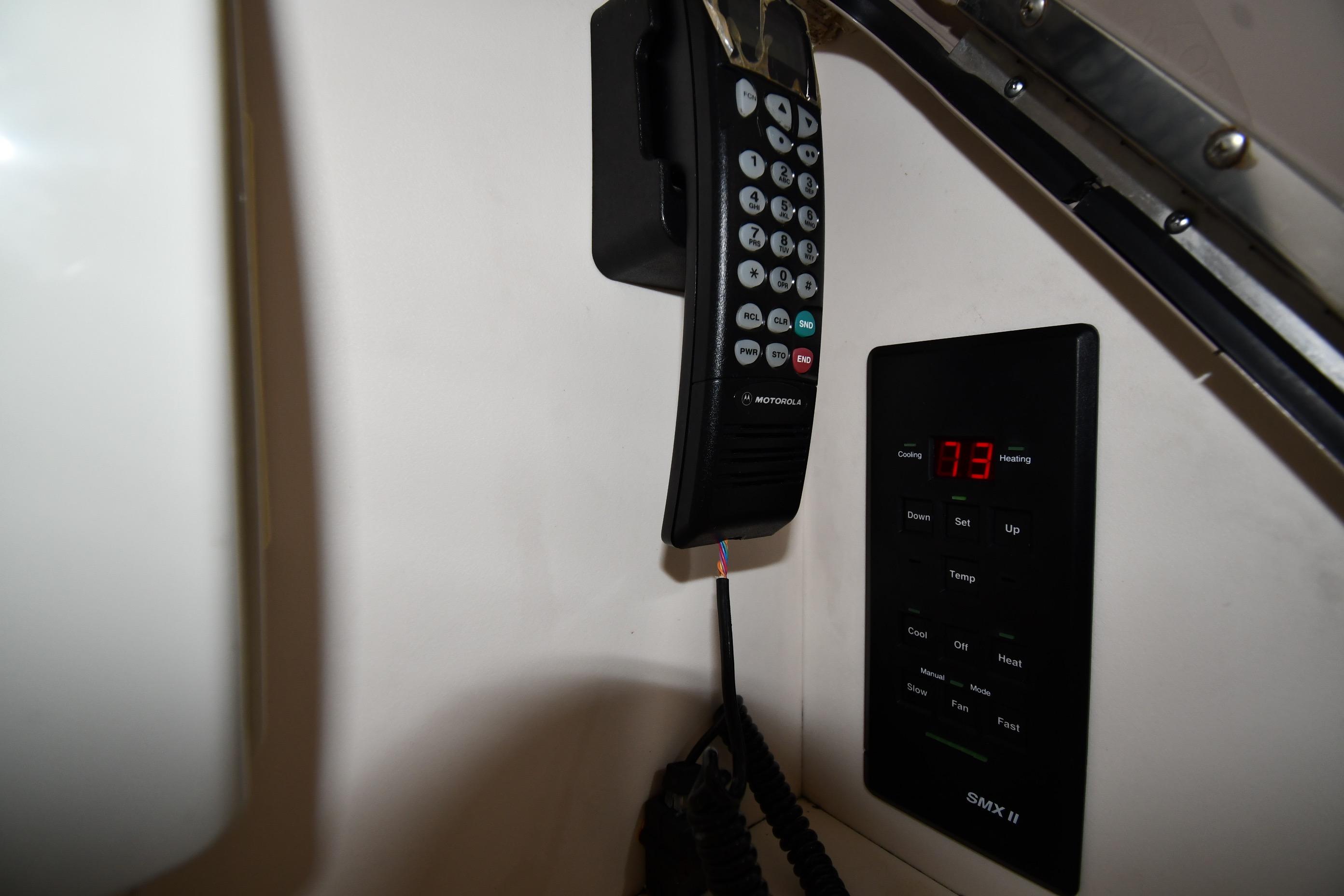 Control panel and Motorola phone in 2001 Sea Ray 540 Sundancer yacht.