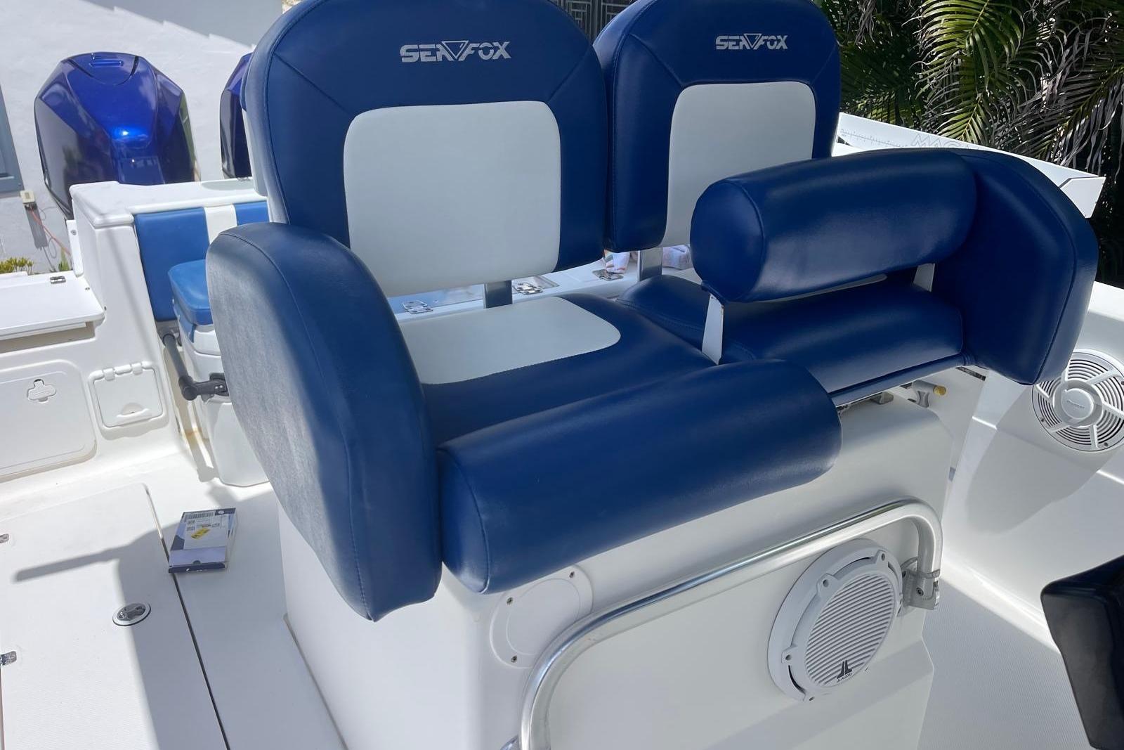 Blue and white seating on 2009 Sea Fox 288 Commander boat deck.