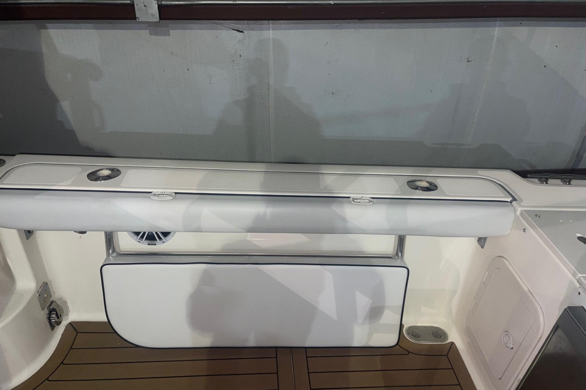 2000 Pursuit 3070 Offshore Center Console boat interior with seating and storage.