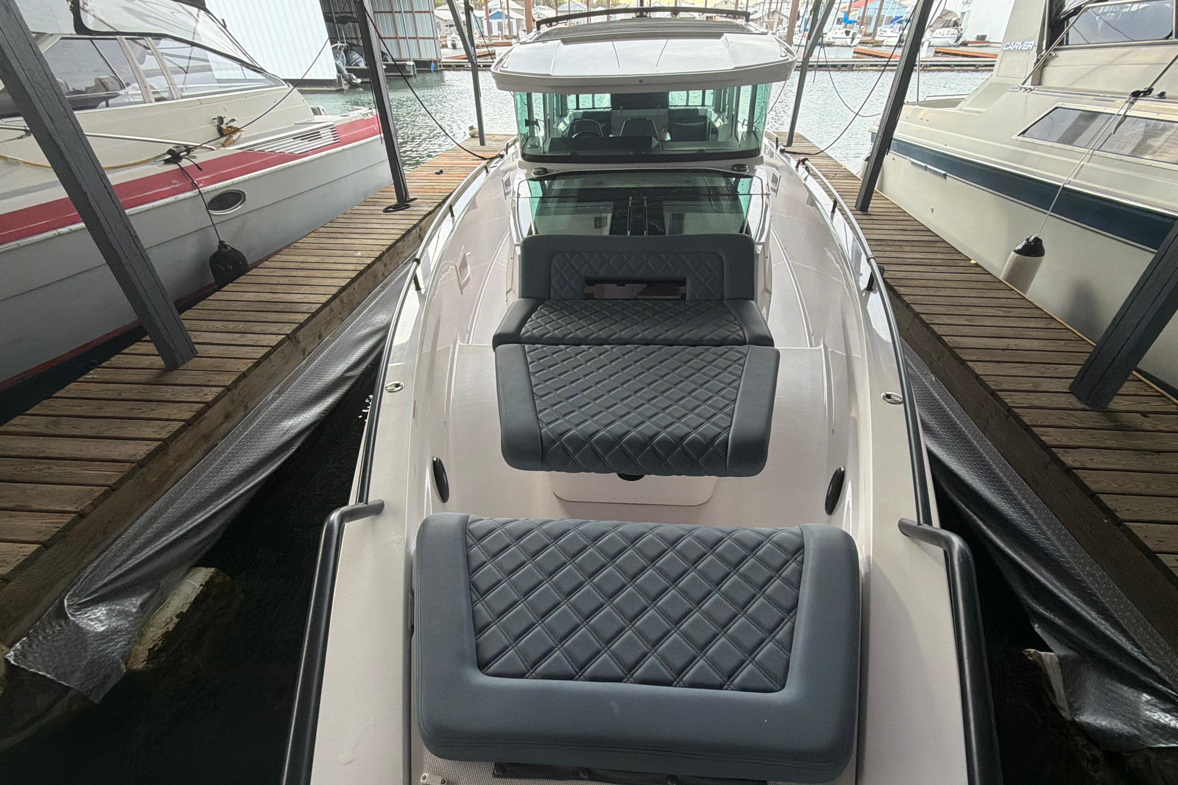 2022 Axopar Brabus 37 XC Cross Cabin docked, featuring luxurious quilted seating.