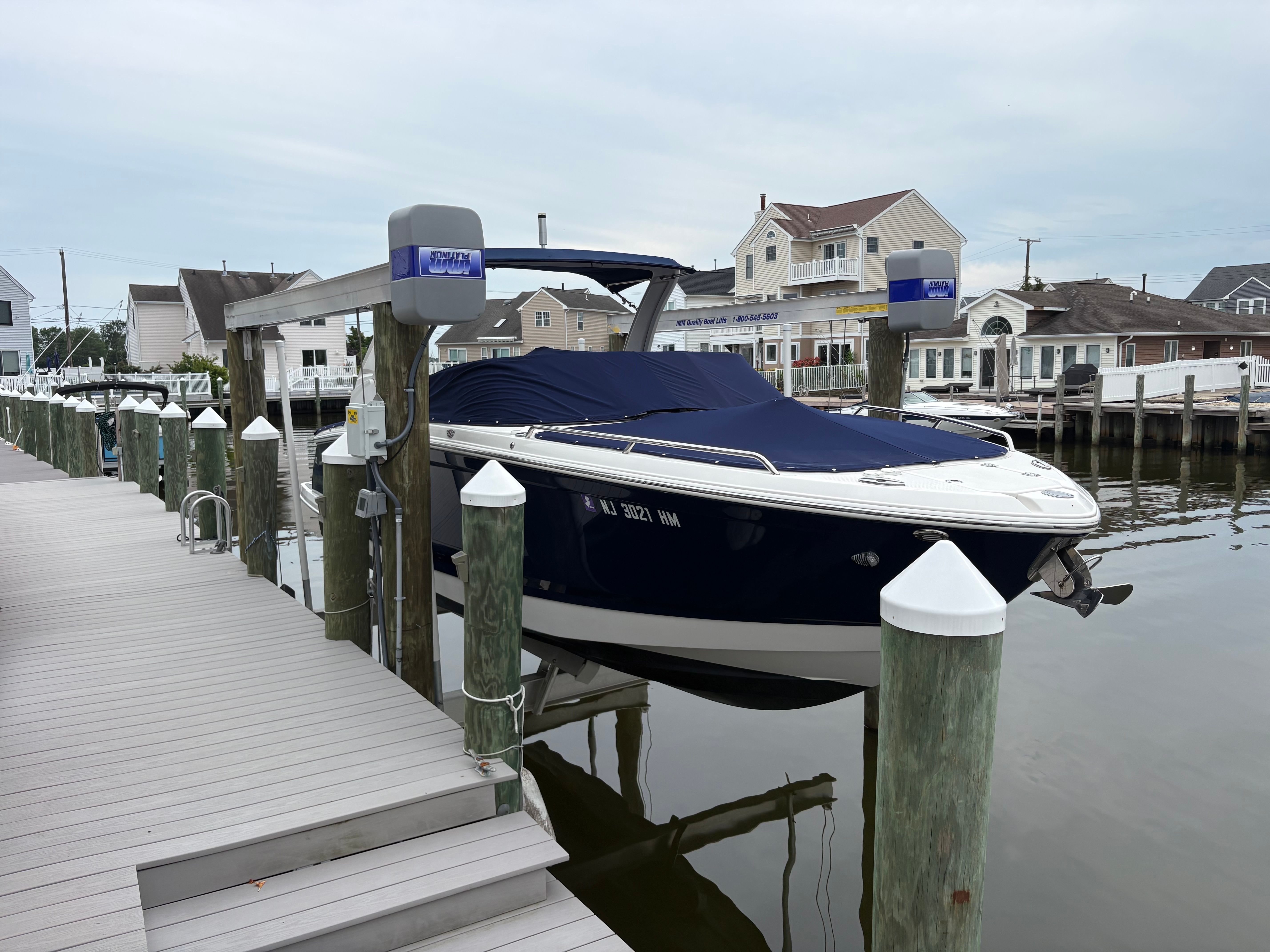A 2019 Chaparral SSX277 is docked in a calm harbor setting.