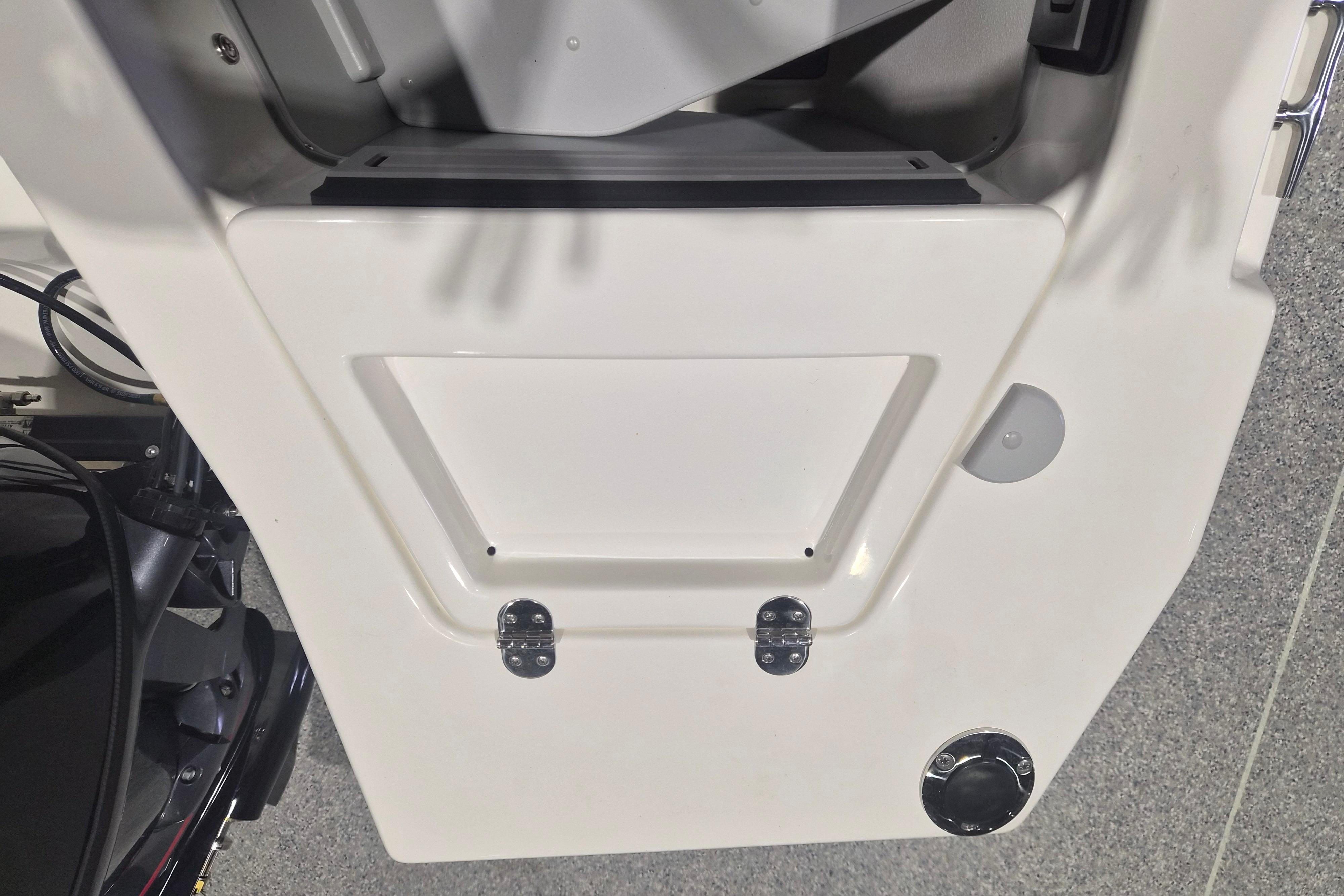 2026 Arima Sea Chaser 19 Yellowtail Edition boat interior detail with storage compartment.