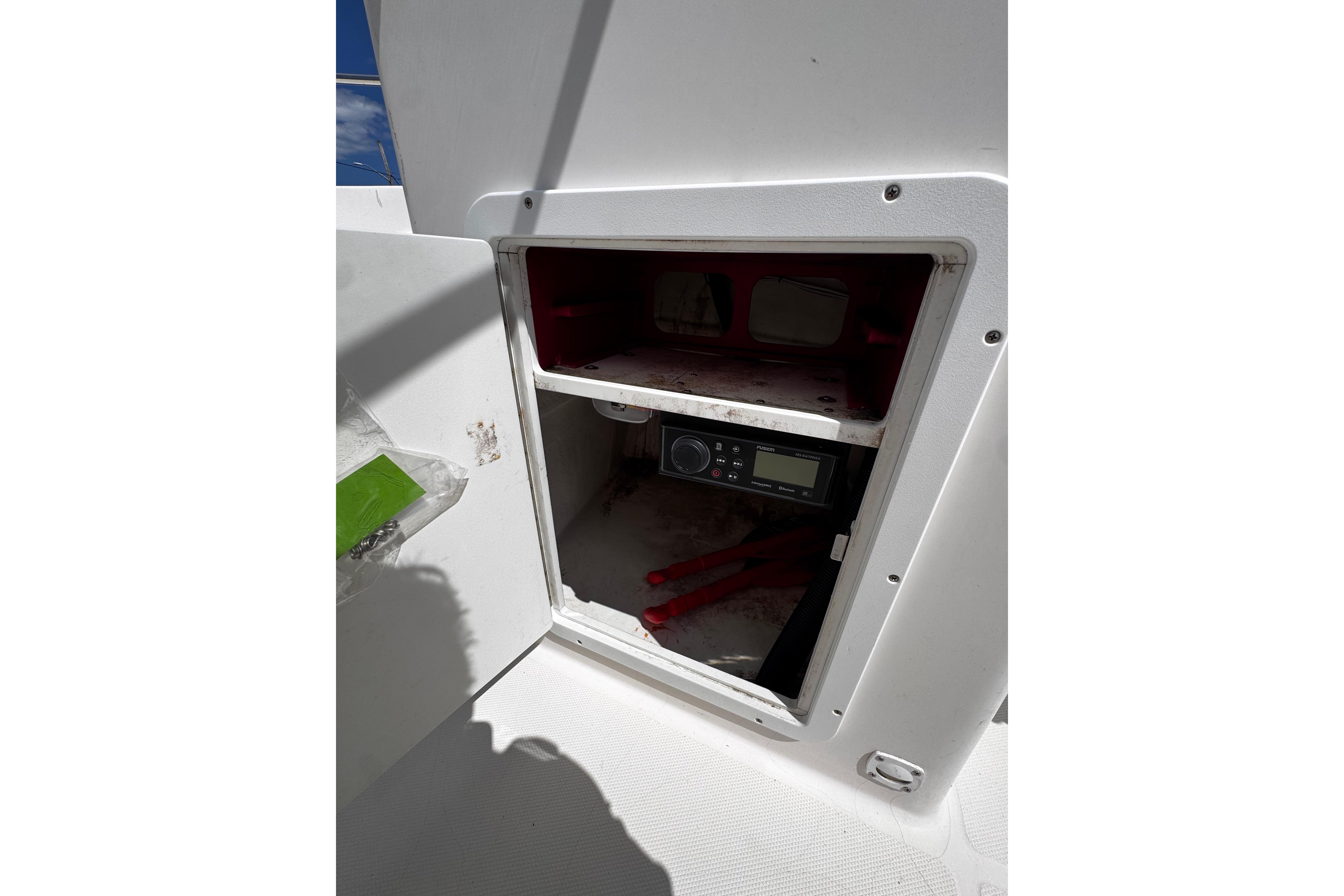 Open storage compartment on 2003 Palm Beach 2200 Dual Console boat.