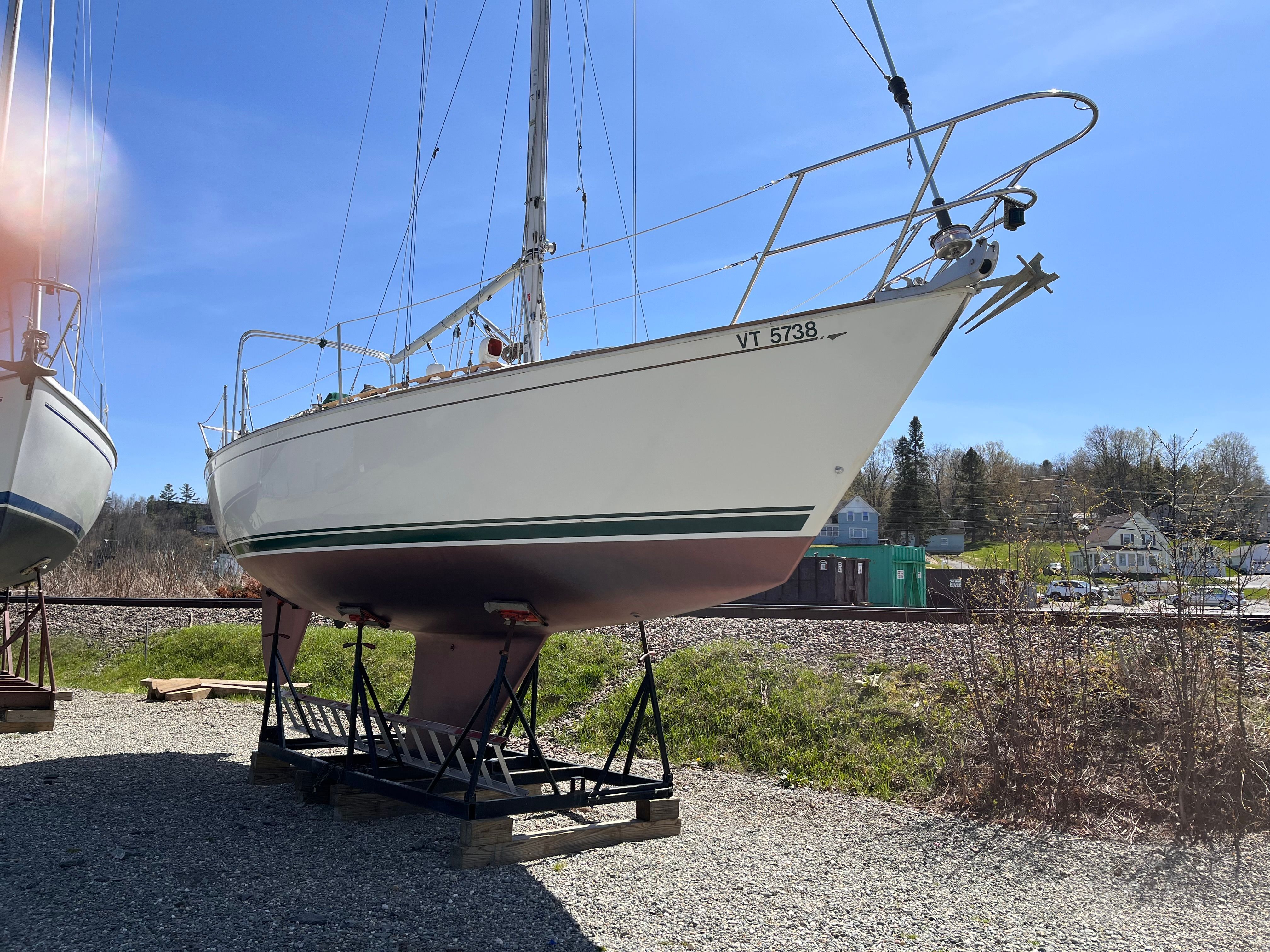 1989 Sabre 30 III sailboat on a stand on land.