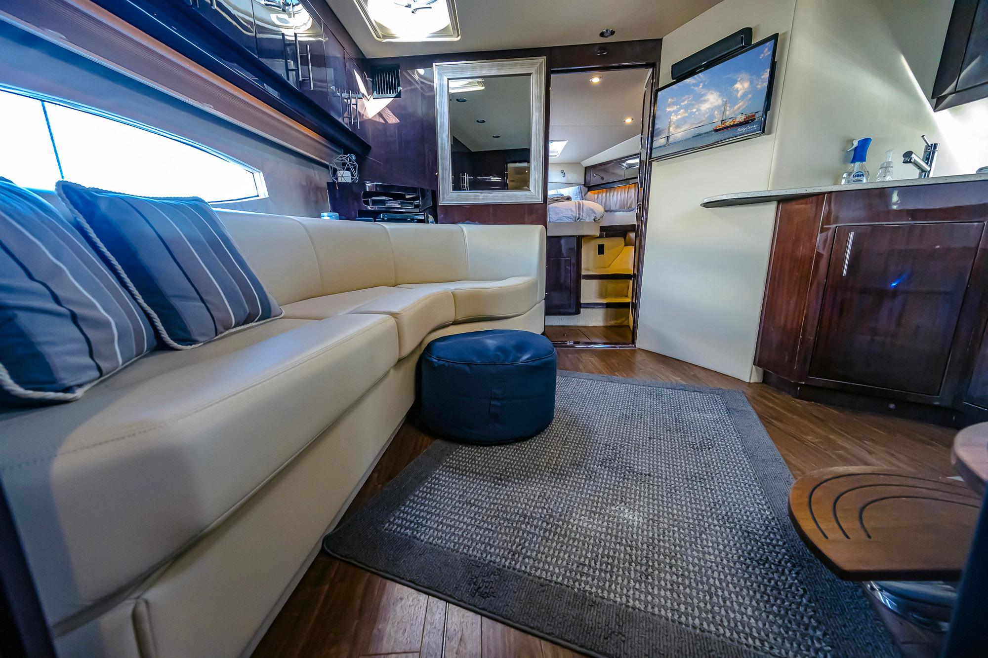 Luxurious interior of 2016 Regal 46 Sport Coupe yacht with modern furnishings.