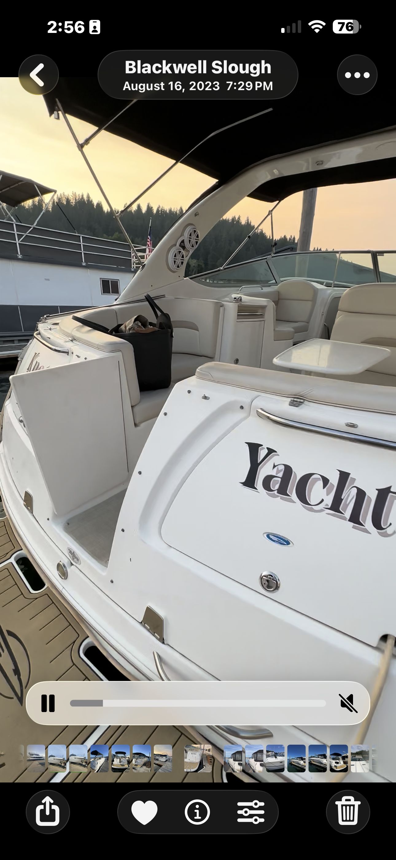 The image shows the stern of a 2004 Chaparral Signature 330 boat docked at a marina.