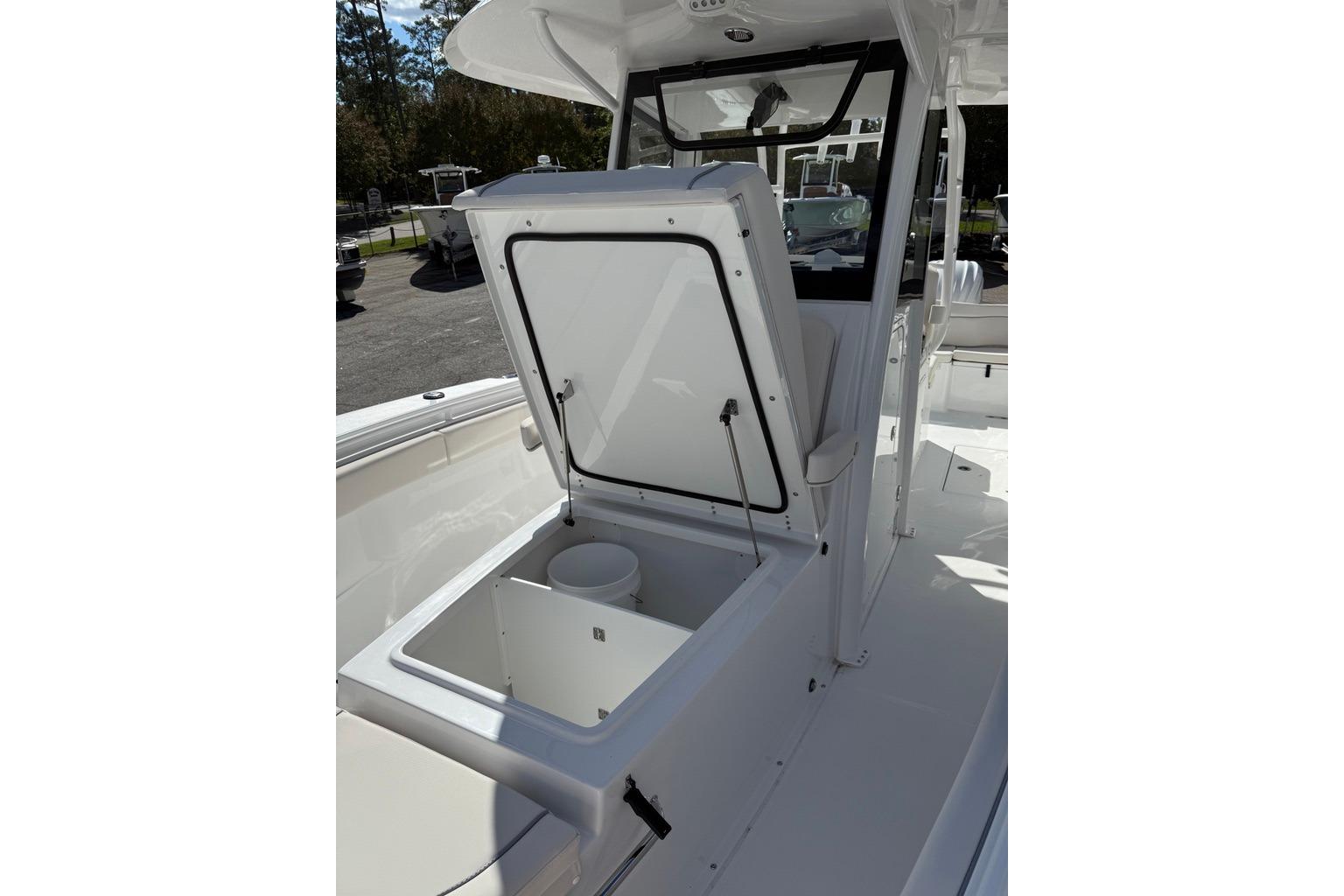 2026 Sea Hunt Ultra 285 Coffin Box with open storage compartment on deck.
