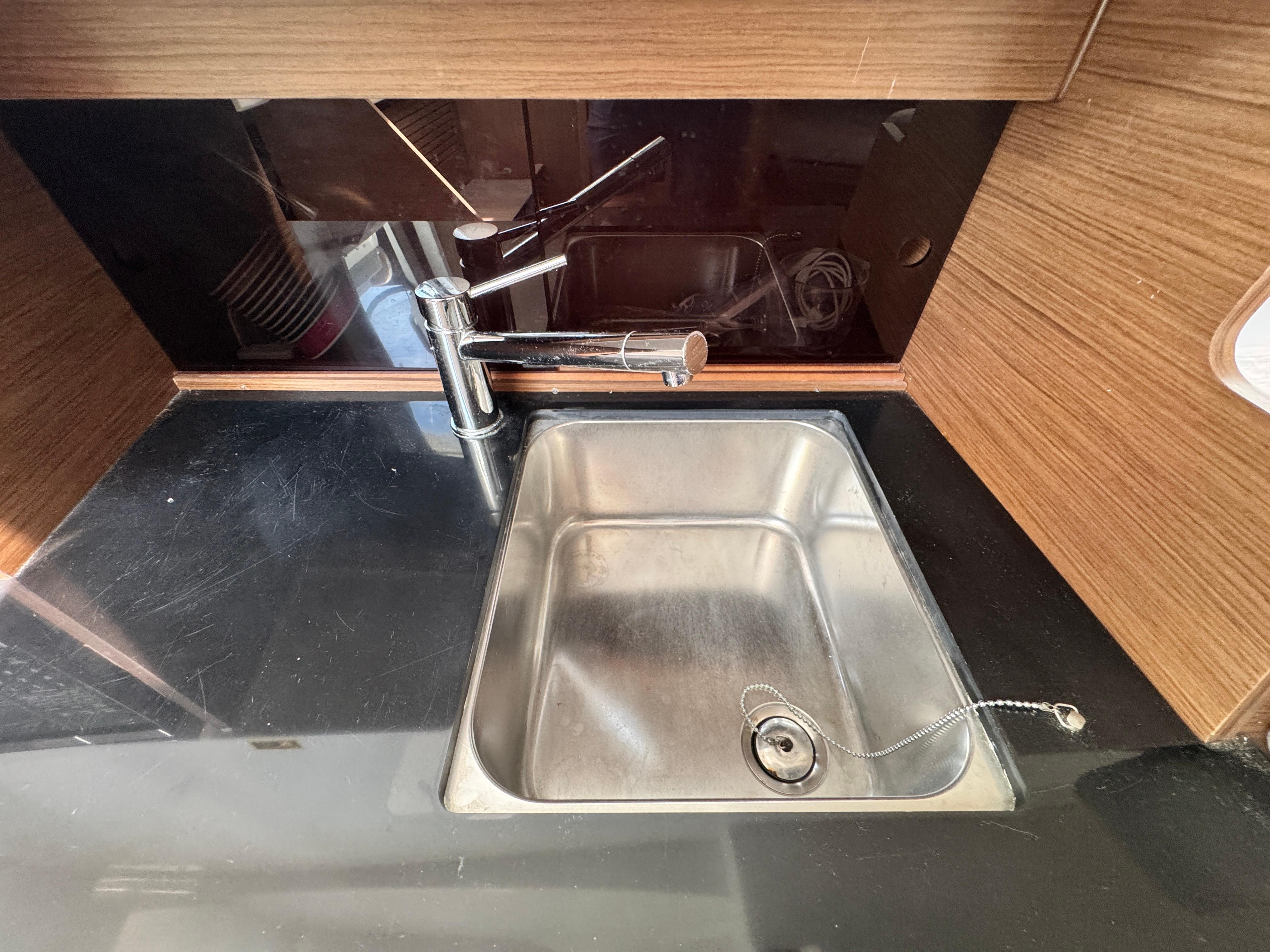 Stainless steel sink in 2022 Beneteau Flyer 9 SUNdeck boat kitchen area.