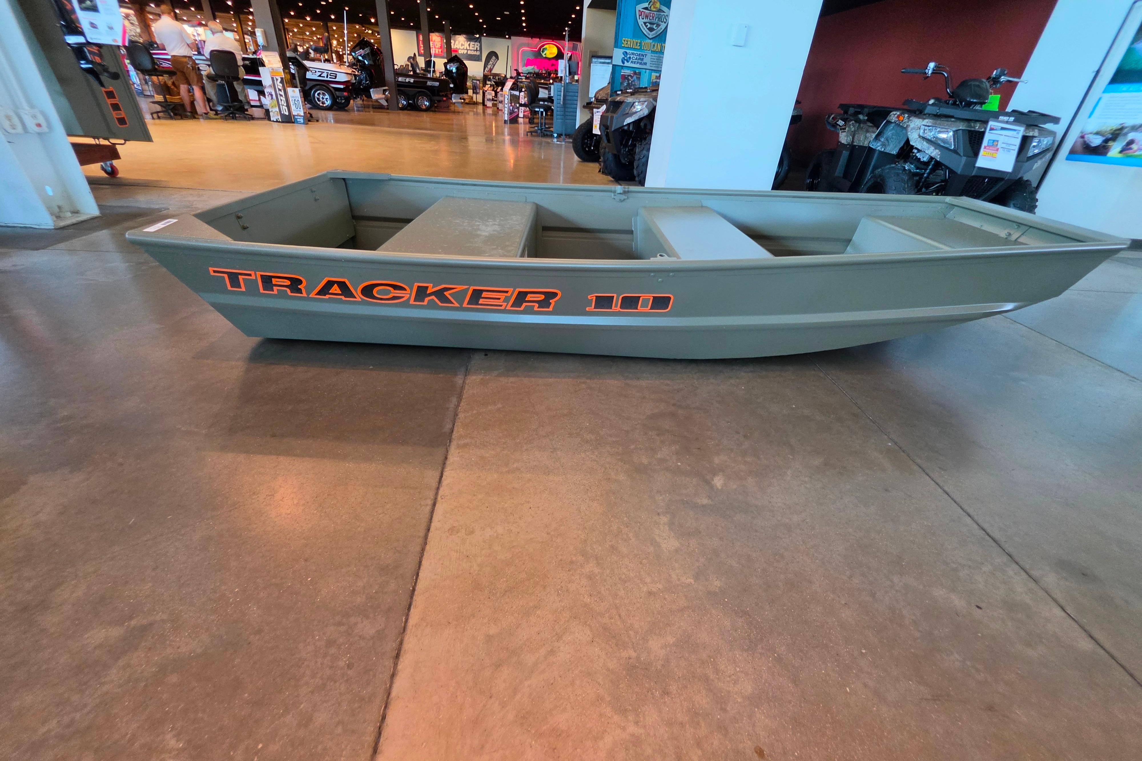 2026 Tracker Grizzly 10 Jon boat displayed indoors, showcasing its sturdy design.