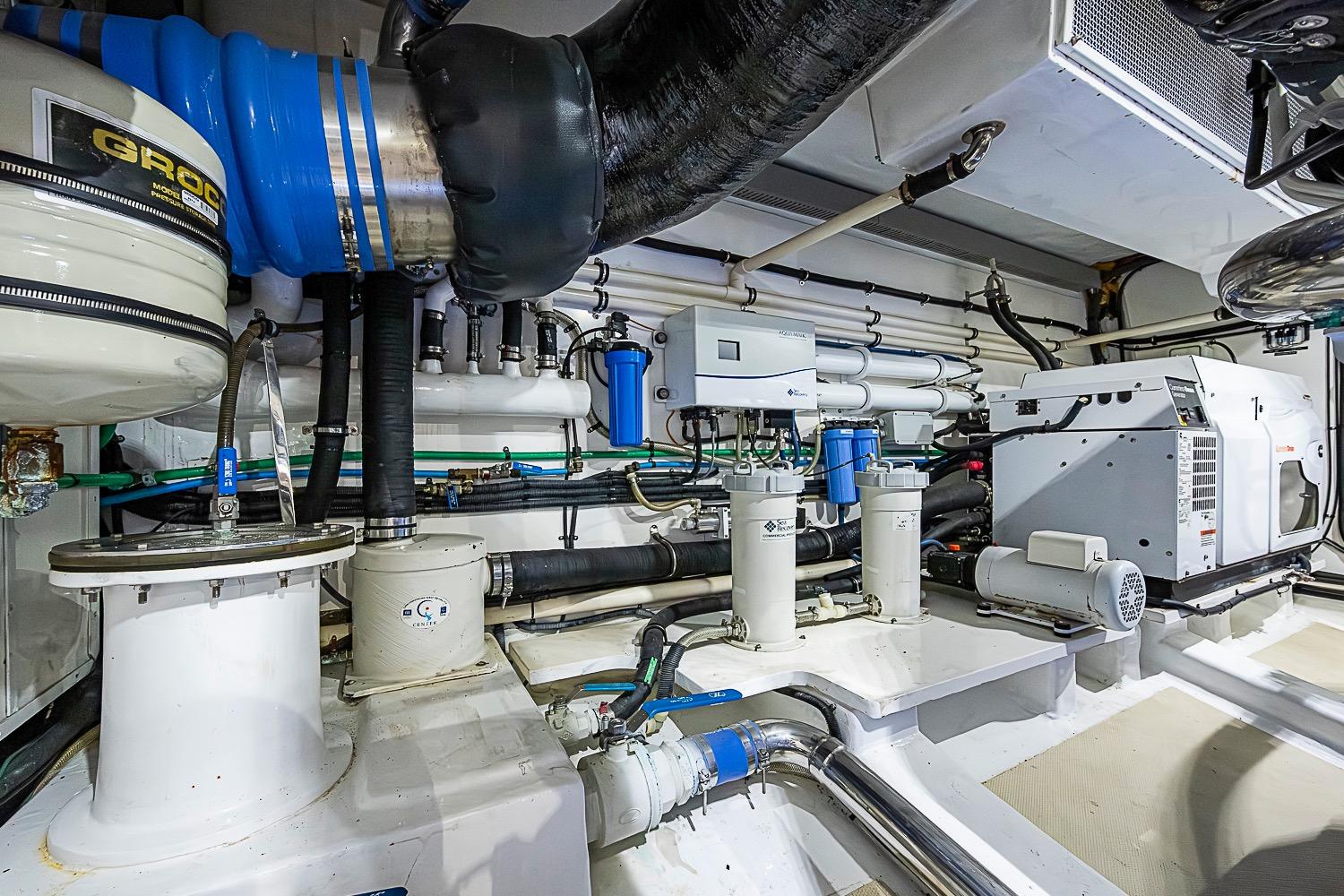 Engine room of 2014 Marlow 80 Explorer yacht, showcasing advanced mechanical systems.