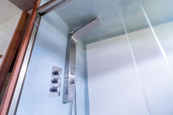 Modern shower in 2025 Catamaran Bloomfield 86 Motorsailor, featuring sleek fixtures and glass enclosure.