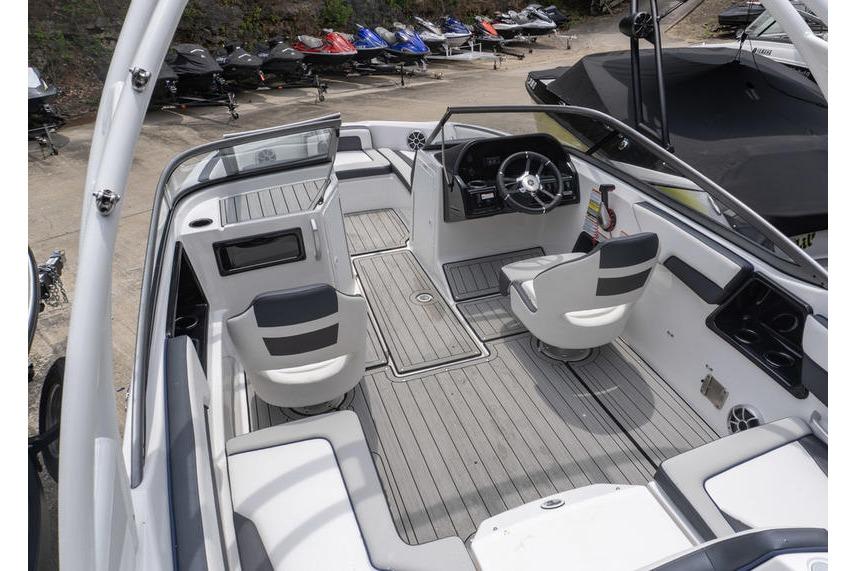 Interior view of a 2021 Yamaha Boats 195S, showcasing sleek seating and modern controls.
