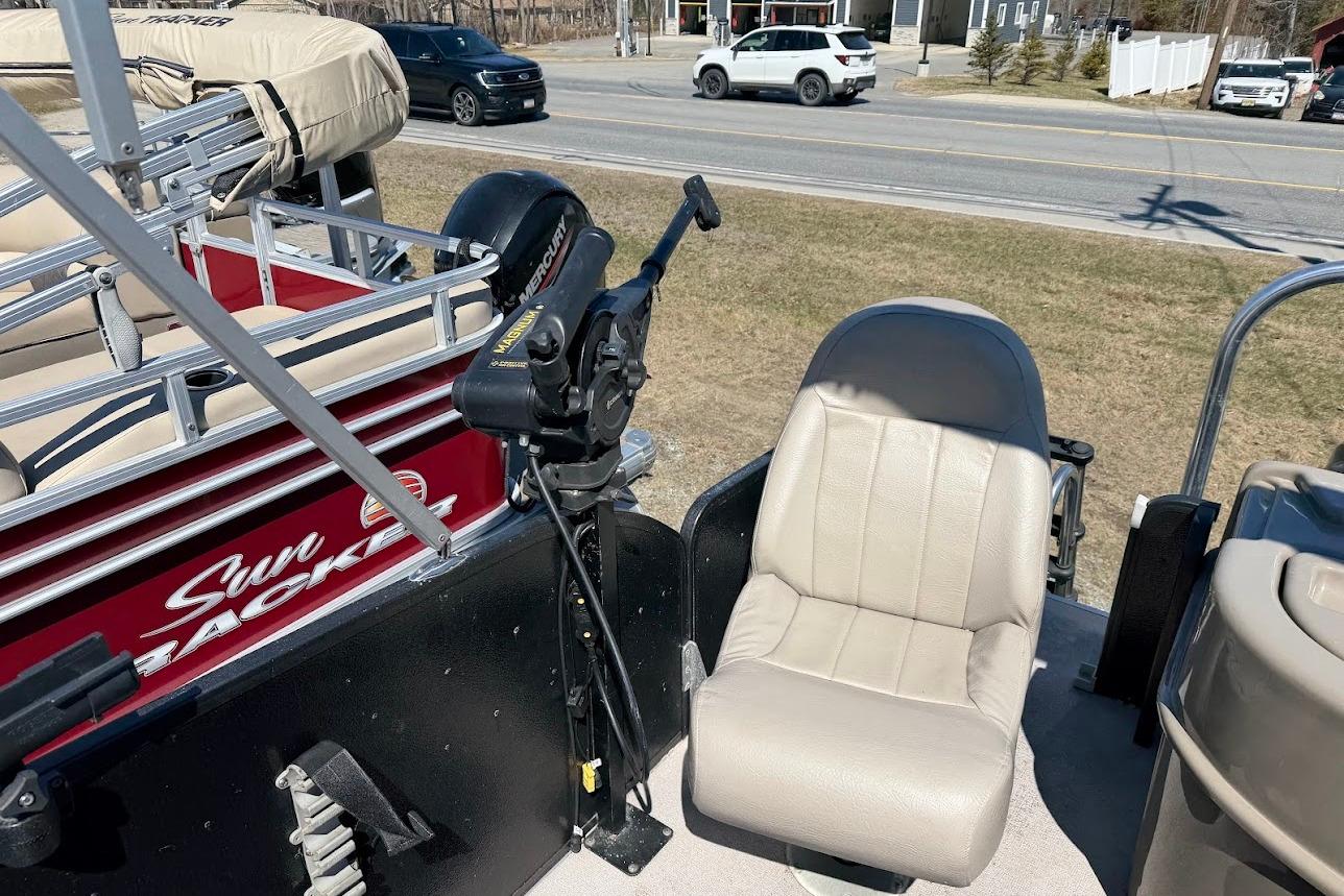 Boat interior with beige seat and motor, Premier 221 Explorer, 2013 model.
