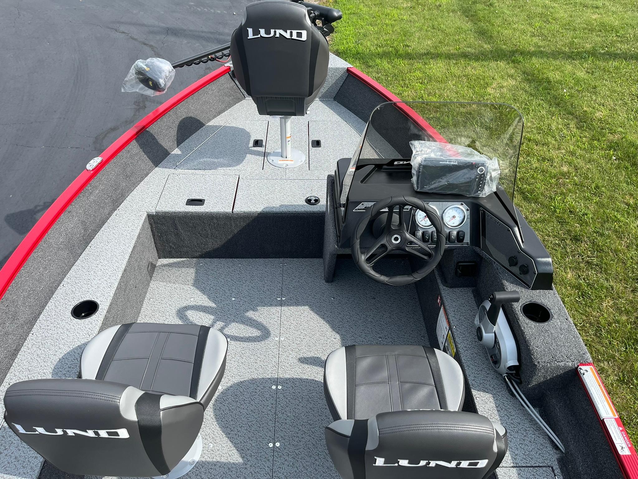 2026 Lund 1650 Angler SS boat interior with steering console and seating.