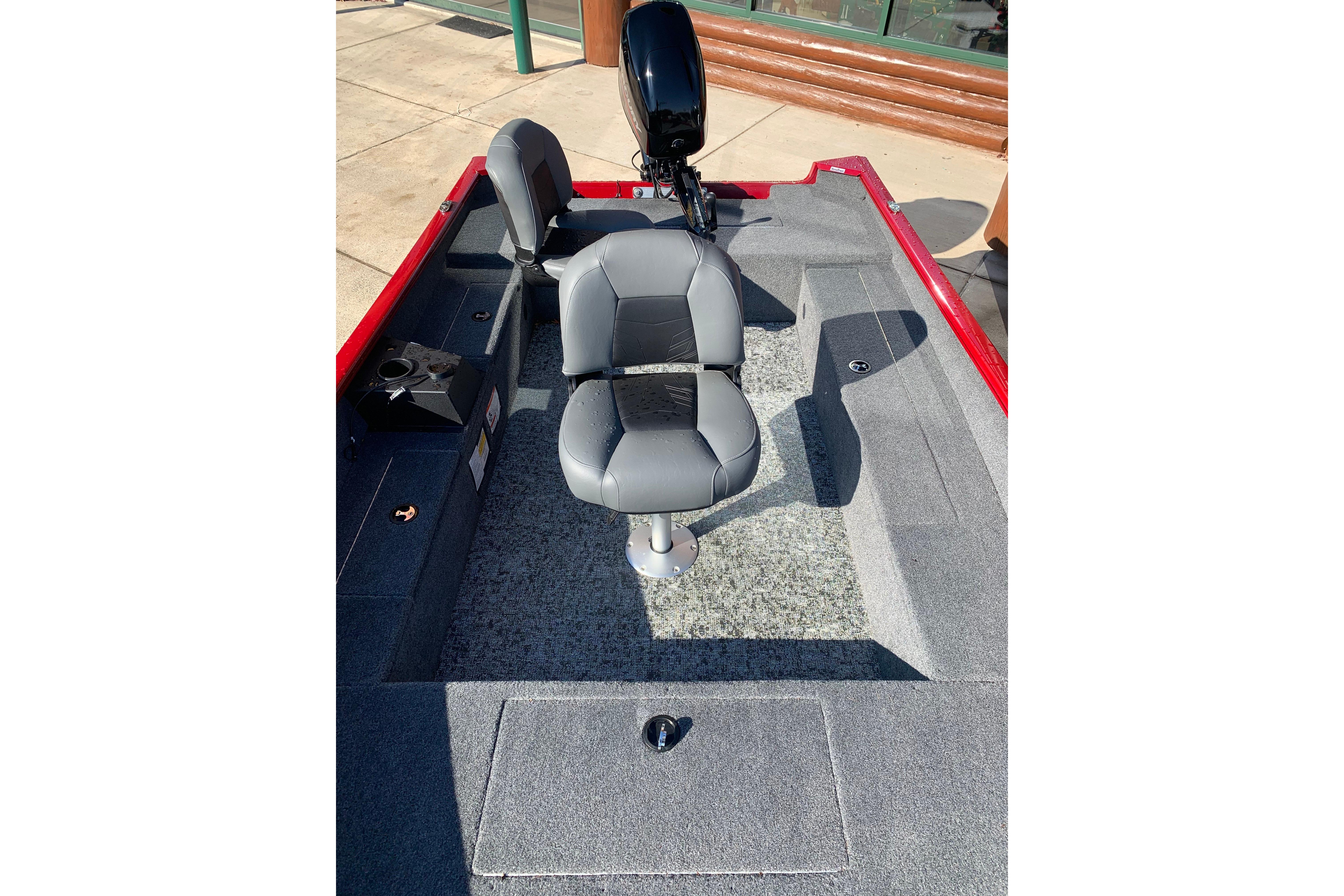 2025 Tracker Super Guide V-16 T boat interior with gray seating and red trim.