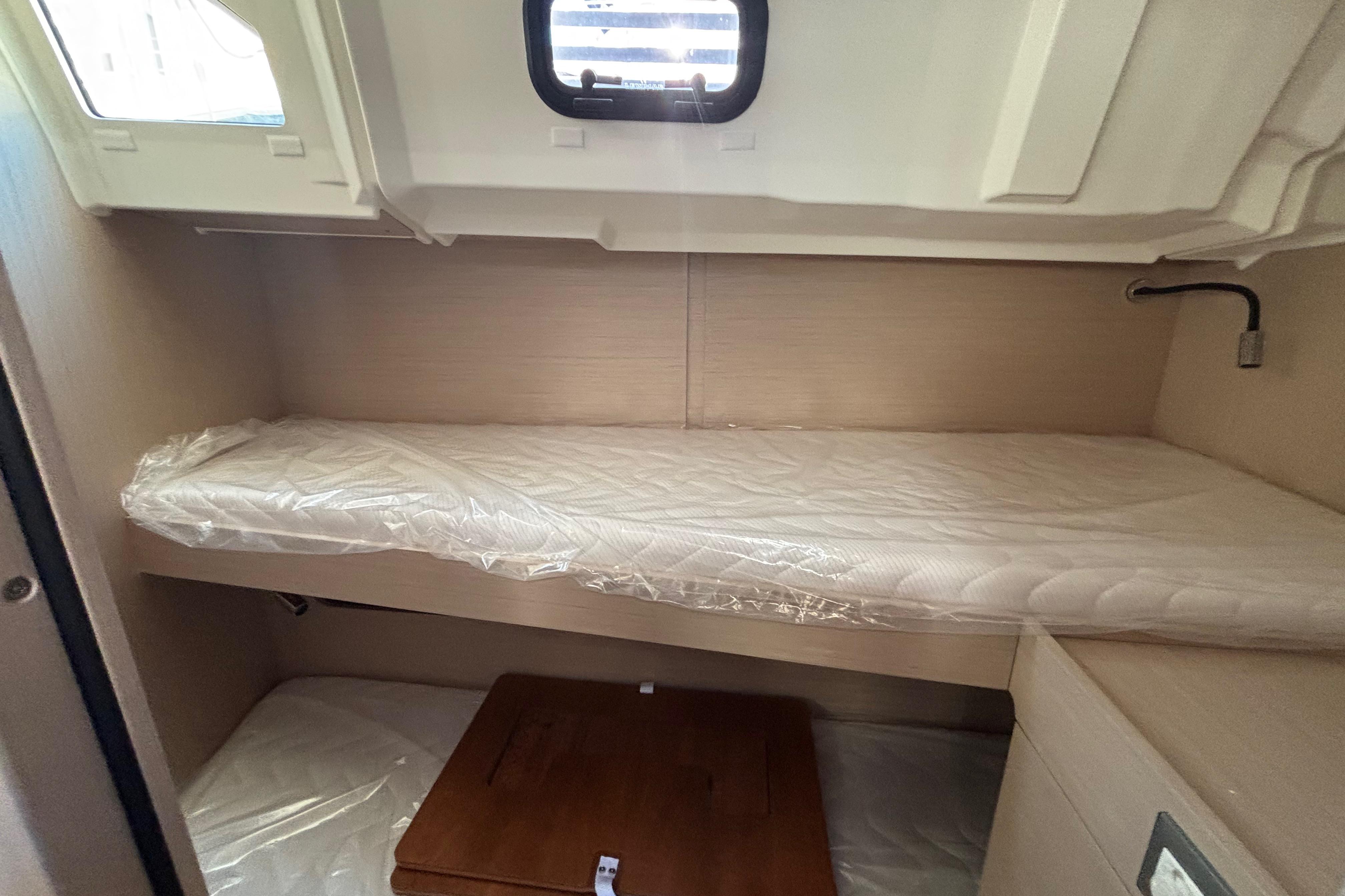 Interior cabin of 2023 Beneteau Oceanis 46.1 yacht with a single bed.