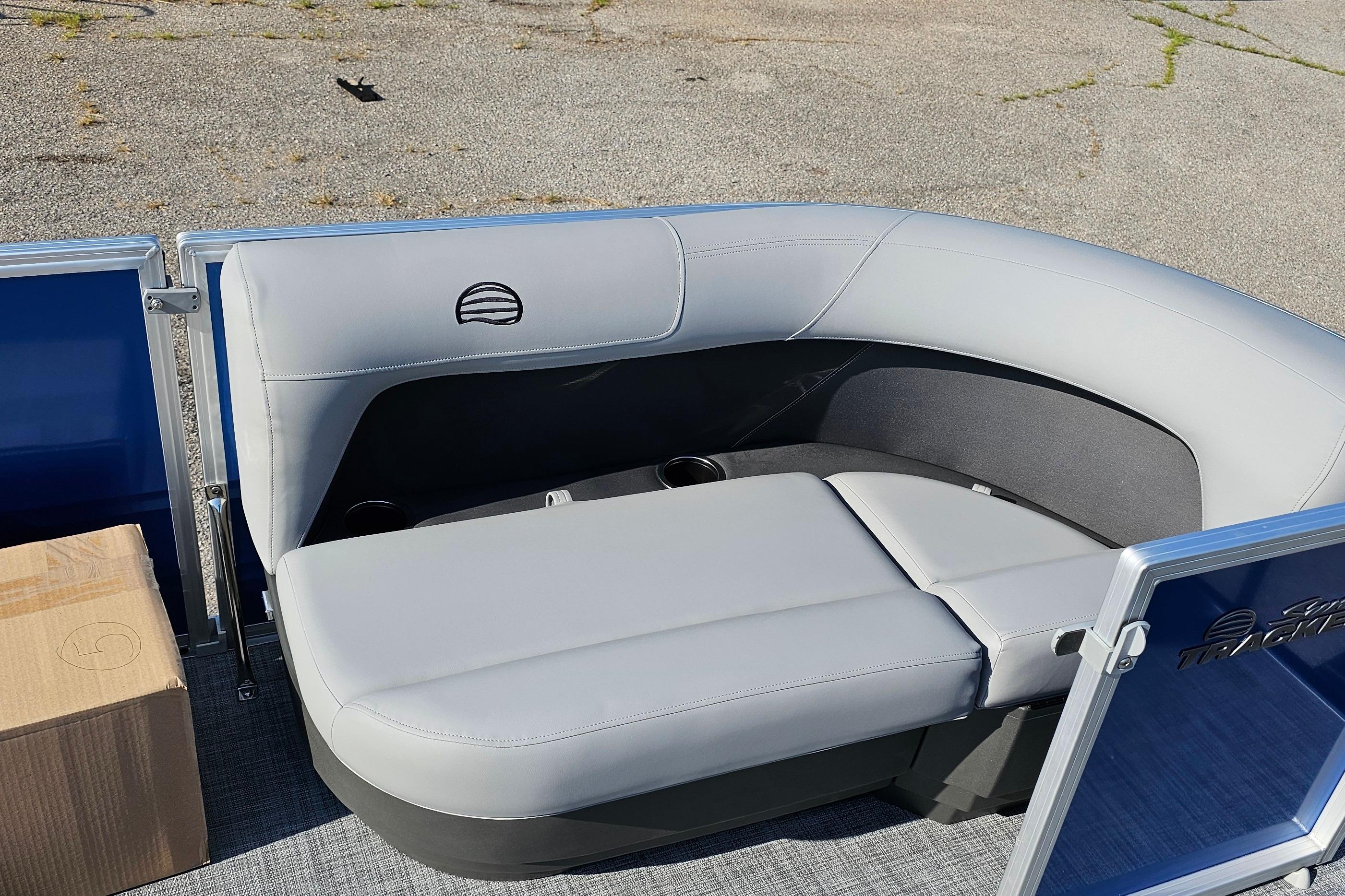 2026 Sun Tracker Party Barge 16 DLX with gray seating and blue accents.