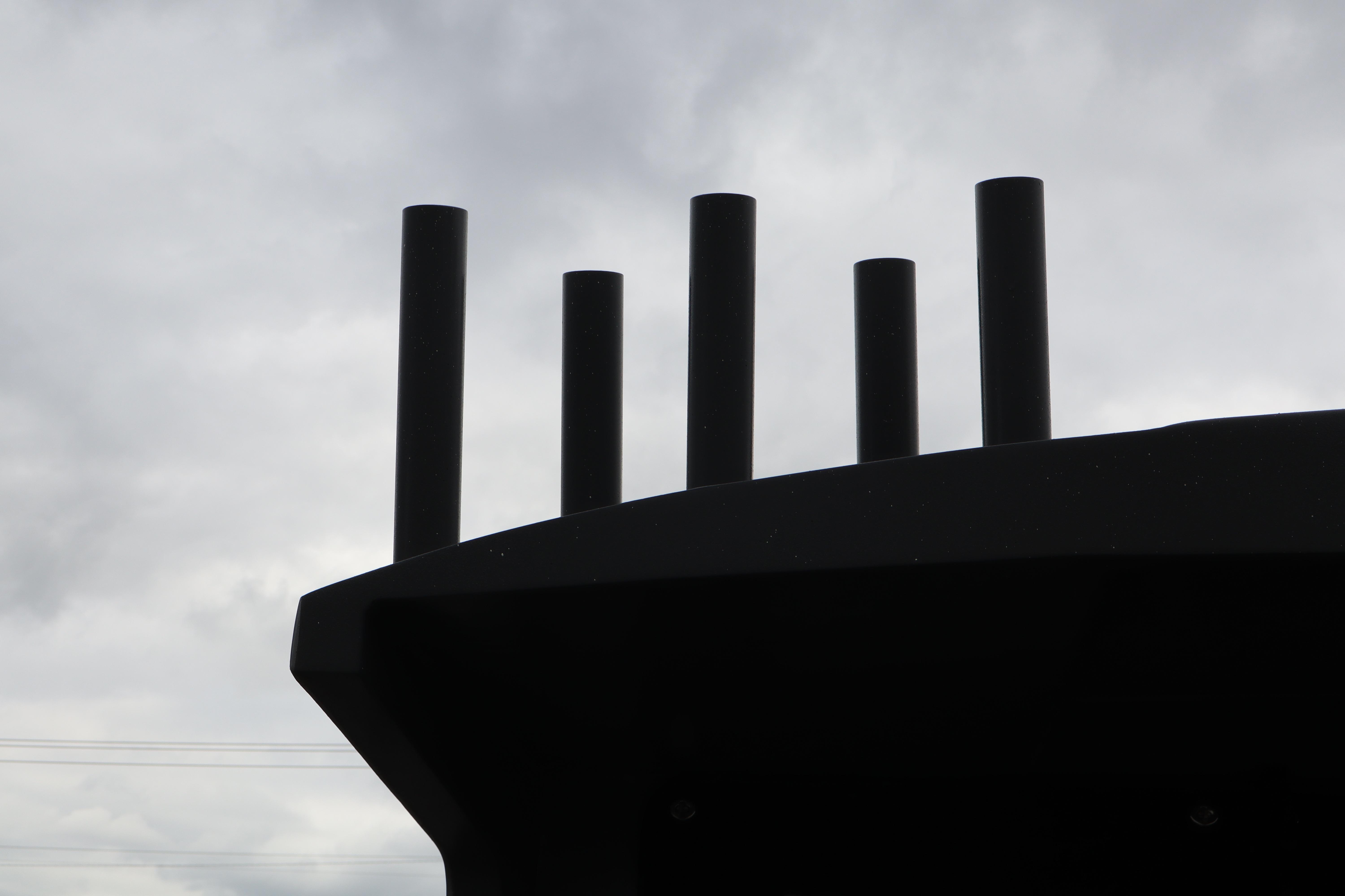 Silhouette of Alumaweld Horizon 24 boat rods against cloudy sky, 2026 model.