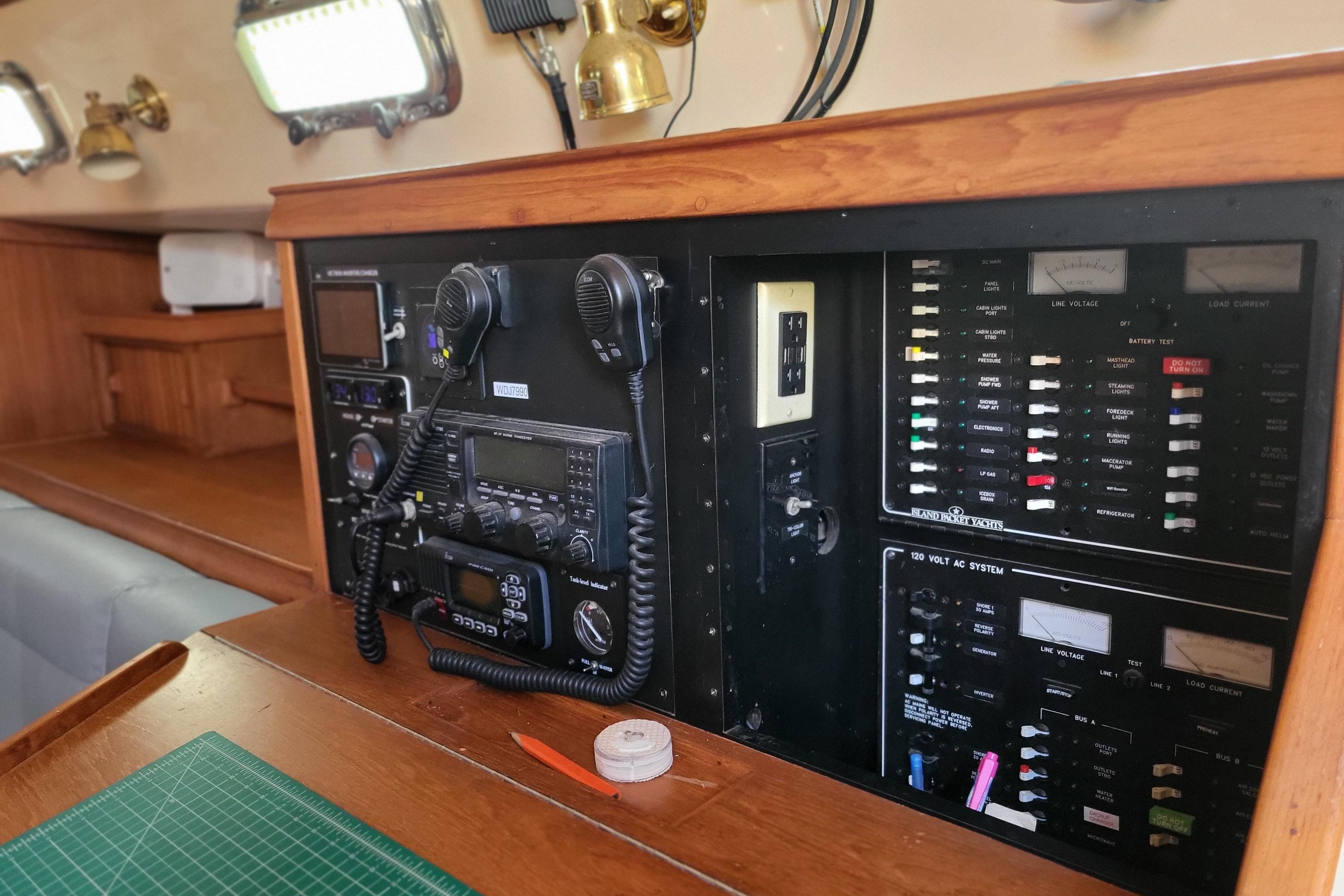 Control panel of a 2000 Island Packet 420 yacht with communication and electrical systems.
