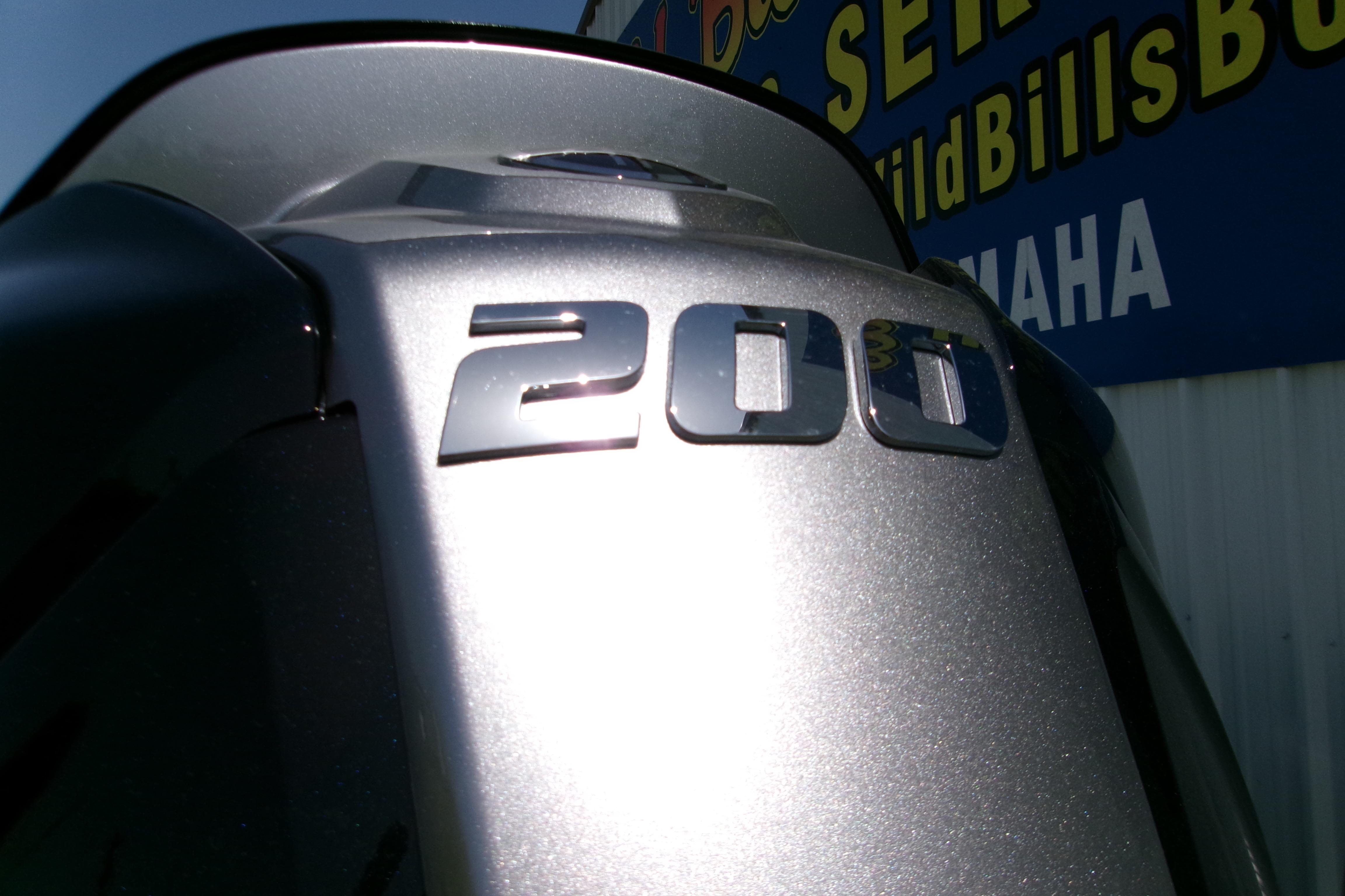 Silver outboard motor with "200" emblem, Xpress H22B Bay 2027 model.