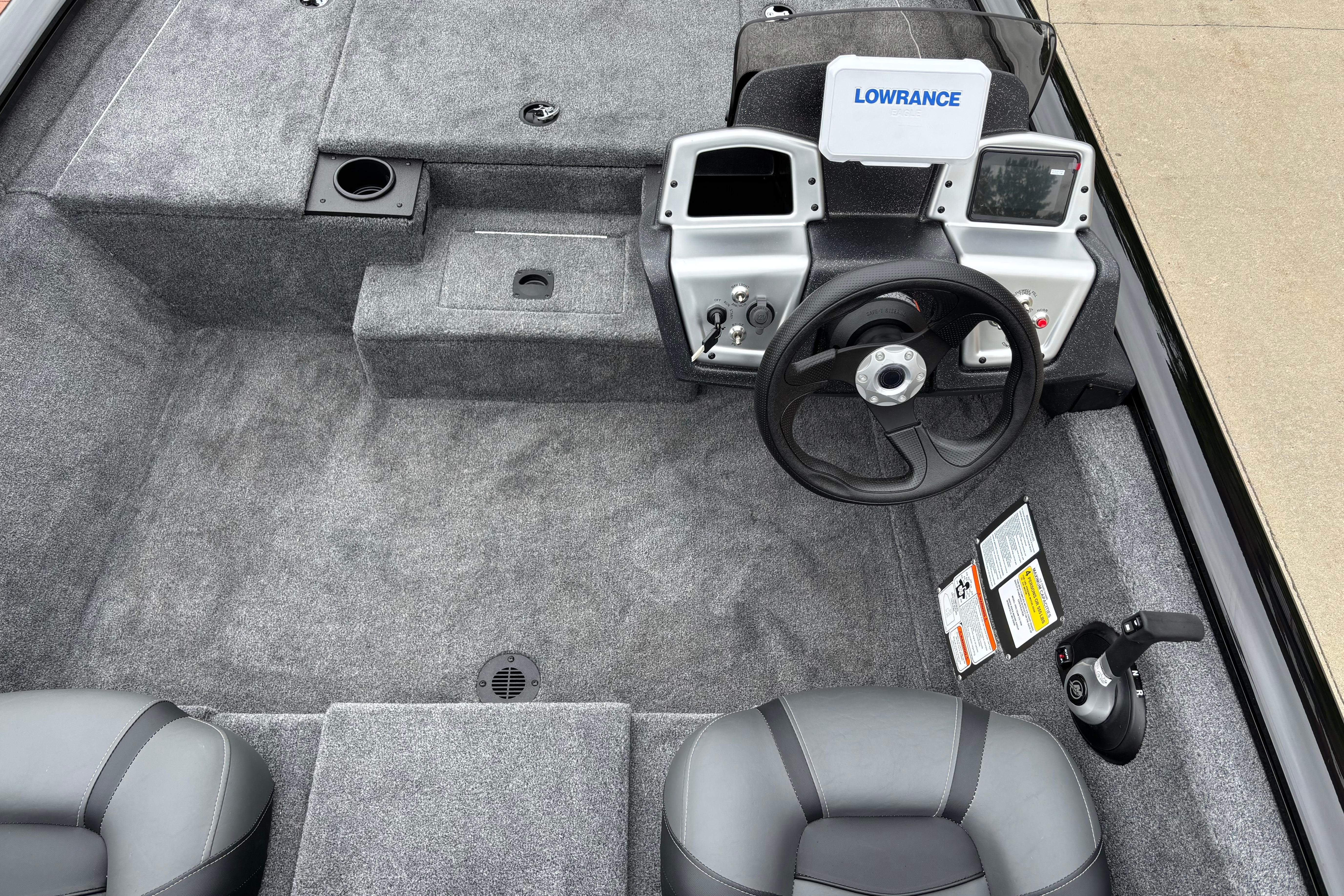2026 Tracker Pro Team 175 boat interior with steering wheel and control panel.