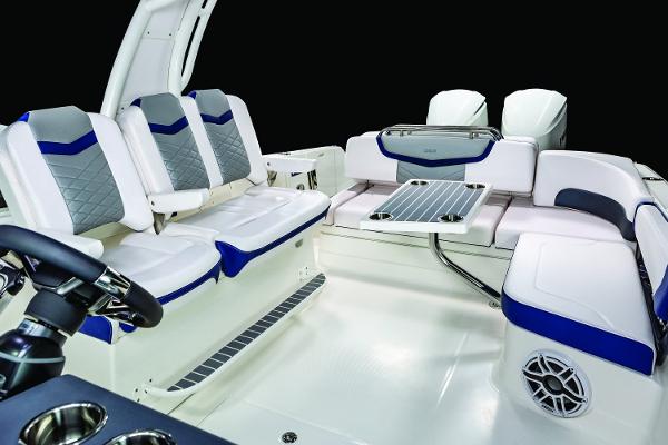 Manufacturer Provided Image: 2019 Chaparral 300 OSX boat interior with seating and table.