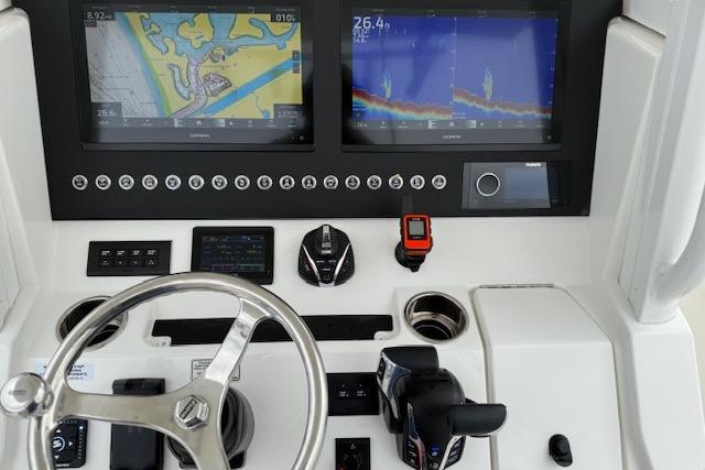 2025 Regulator 28 boat dashboard with navigation screens and controls.