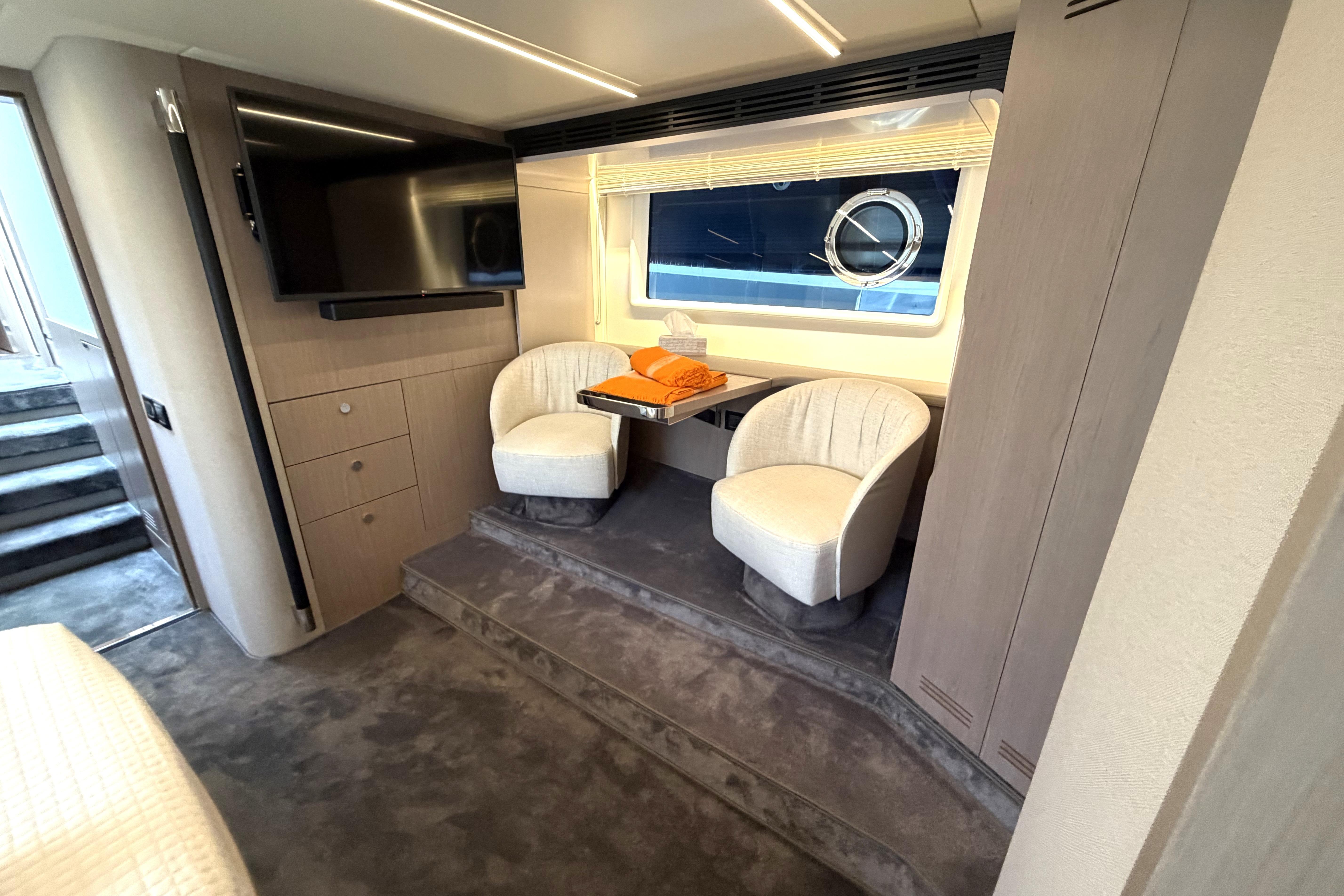 Luxurious interior of 2021 Azimut 66 yacht with seating area and TV.