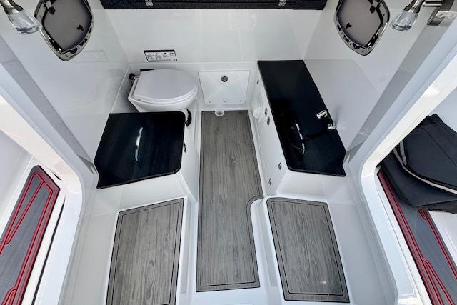 Interior of 2026 Monterey Elite 25 OB boat, featuring modern bathroom amenities and sleek design.