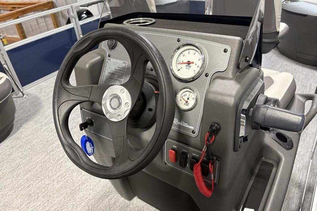Steering console of 2026 Sun Tracker Bass Buggy 18 DLX pontoon boat.