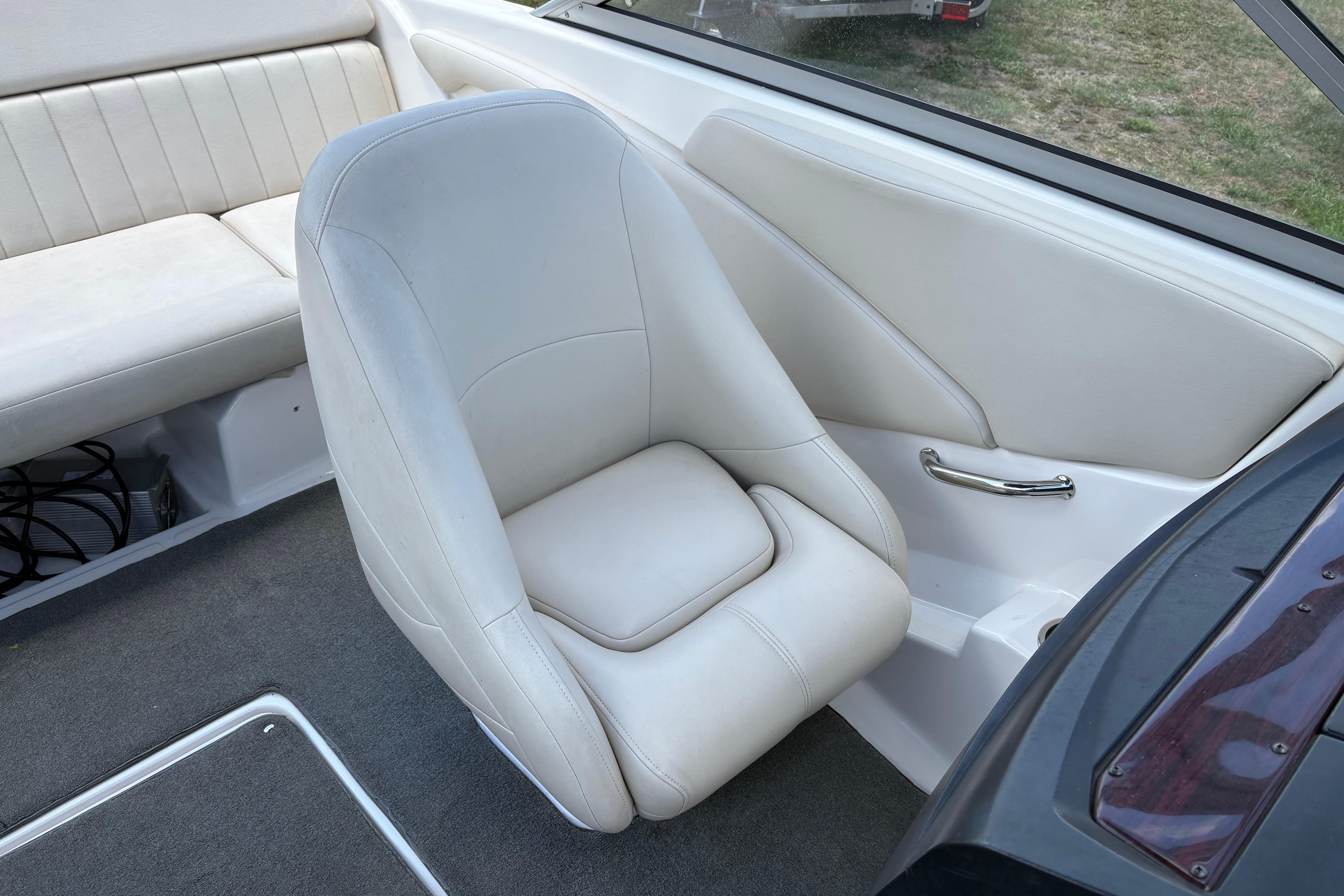 2008 Regal 1900 Bowrider interior with white seating and carpeted flooring.