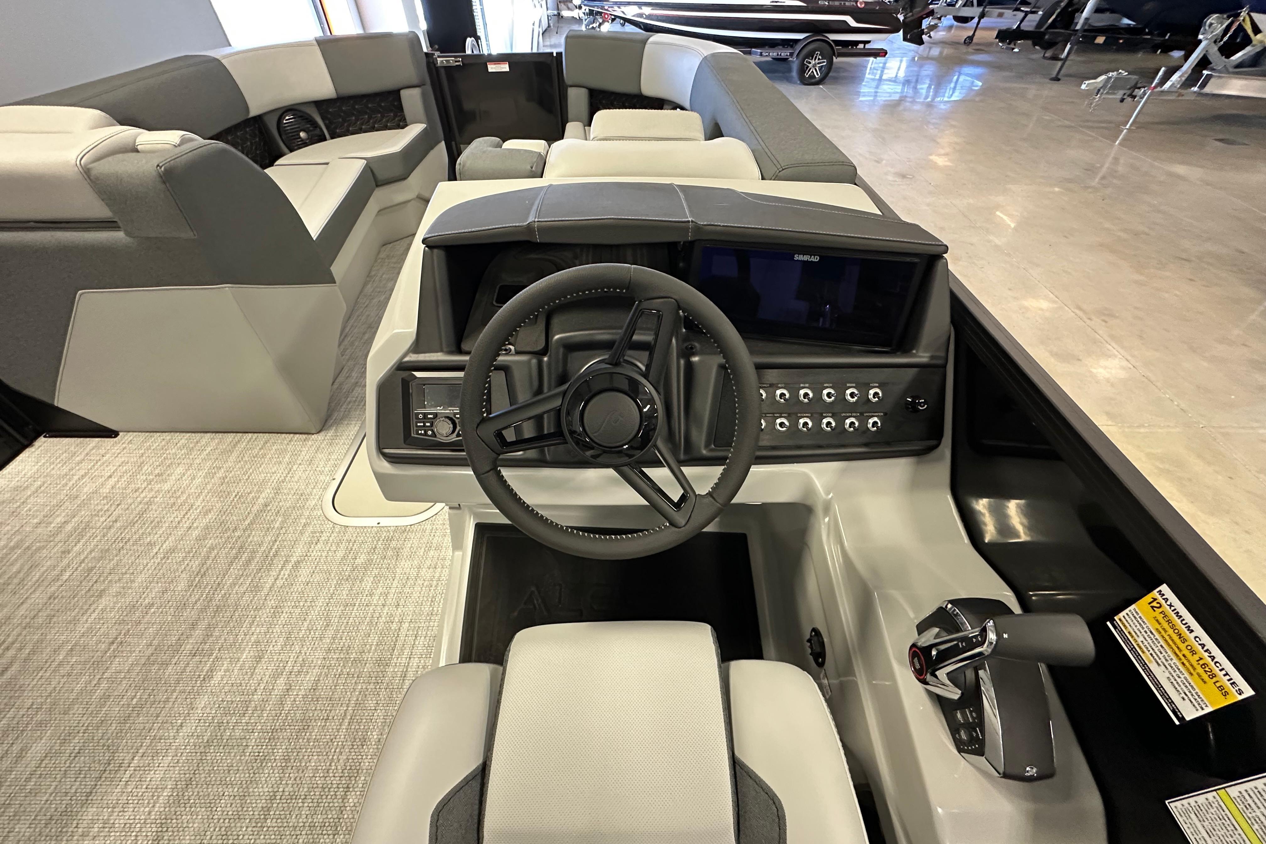 2026 Alera M25L boat interior with modern steering and control panel.