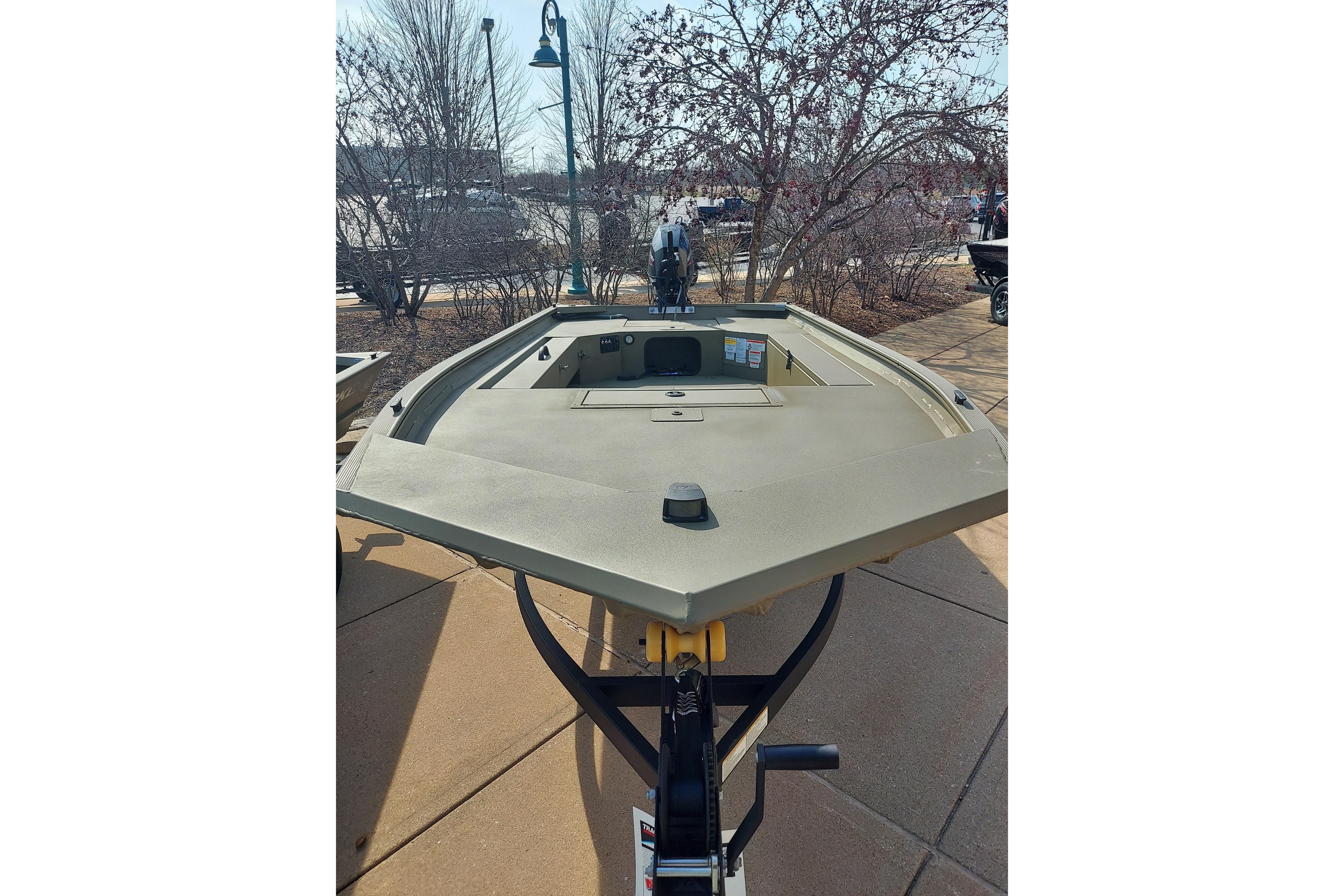 2026 Tracker Grizzly 1654 T Sportsman boat displayed outdoors on a trailer.