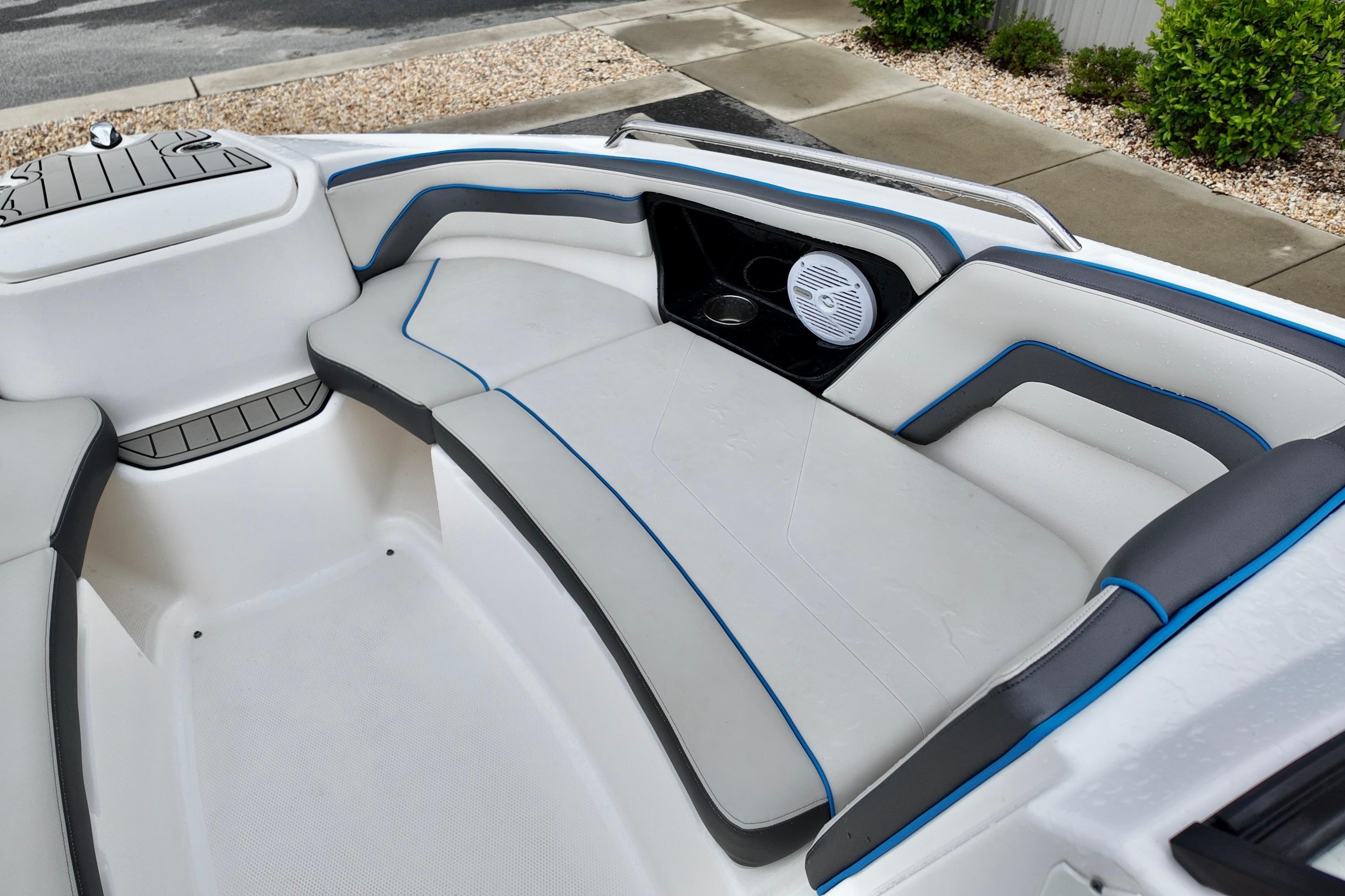 Interior seating of a 2020 Yamaha Boats AR240, featuring sleek white and gray upholstery.