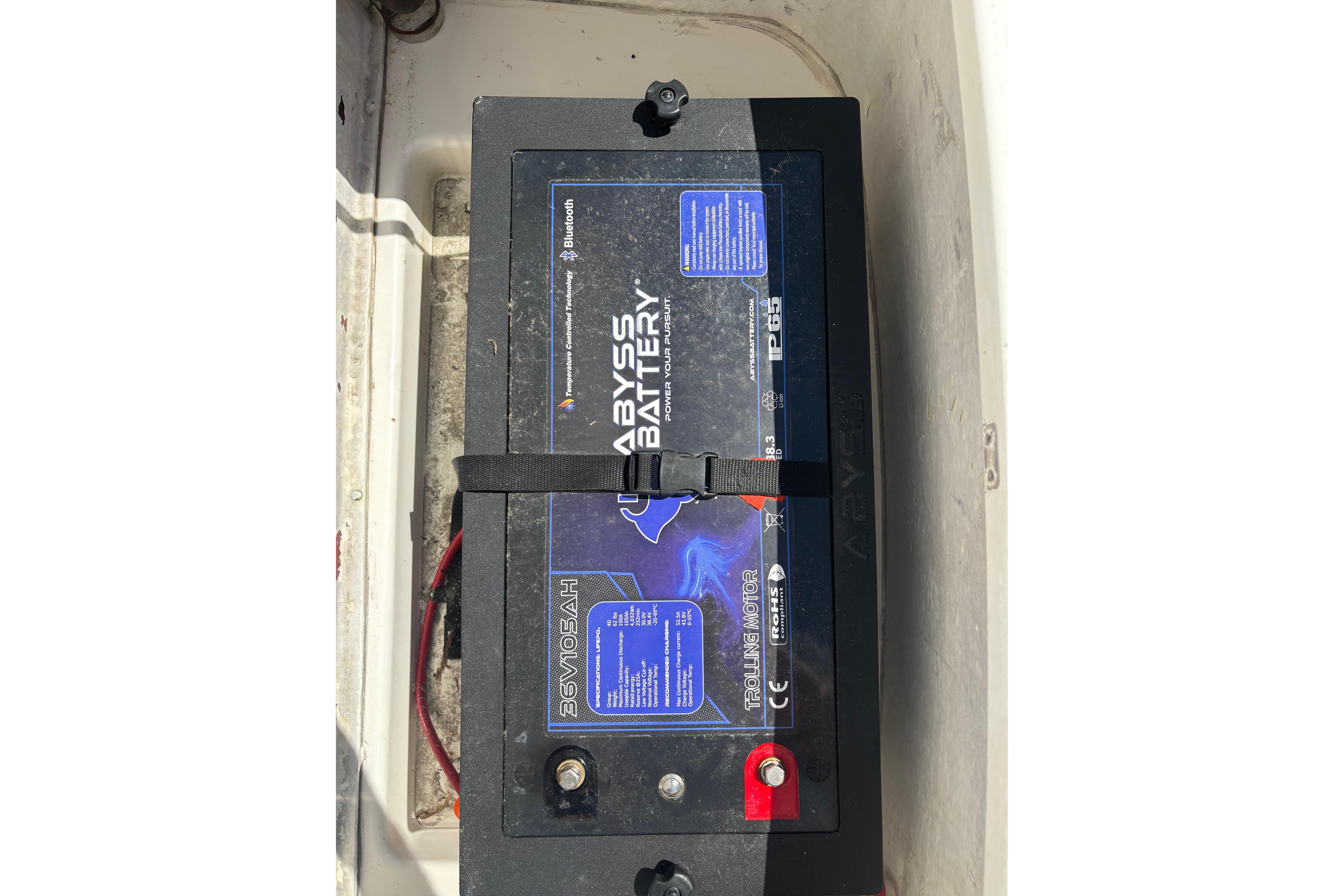 Battery installed in a 2006 Edgewater 318CC boat, featuring Abyss Battery branding.