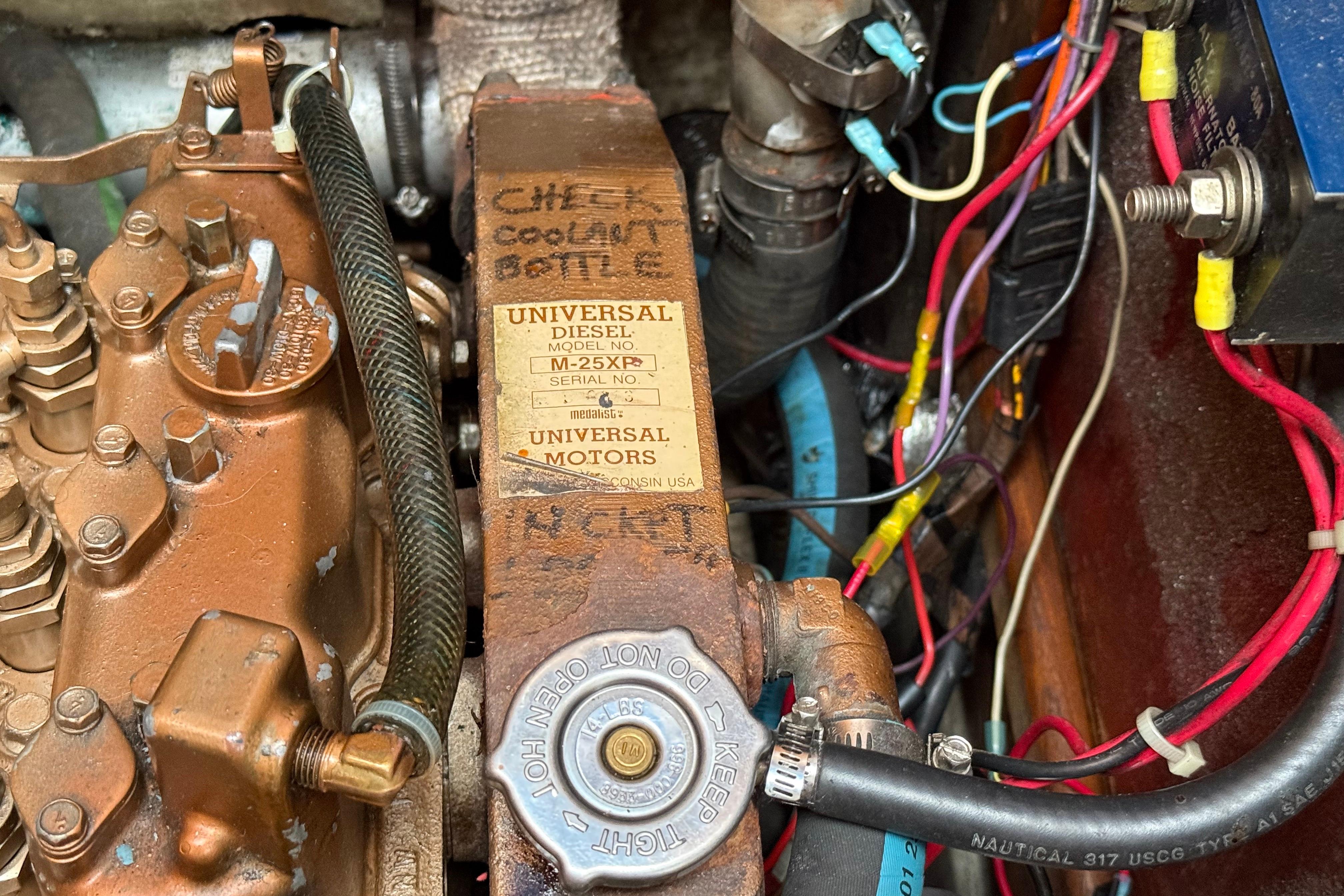 Engine compartment of a 1988 Ericson 32-200 sailboat with Universal Diesel engine.