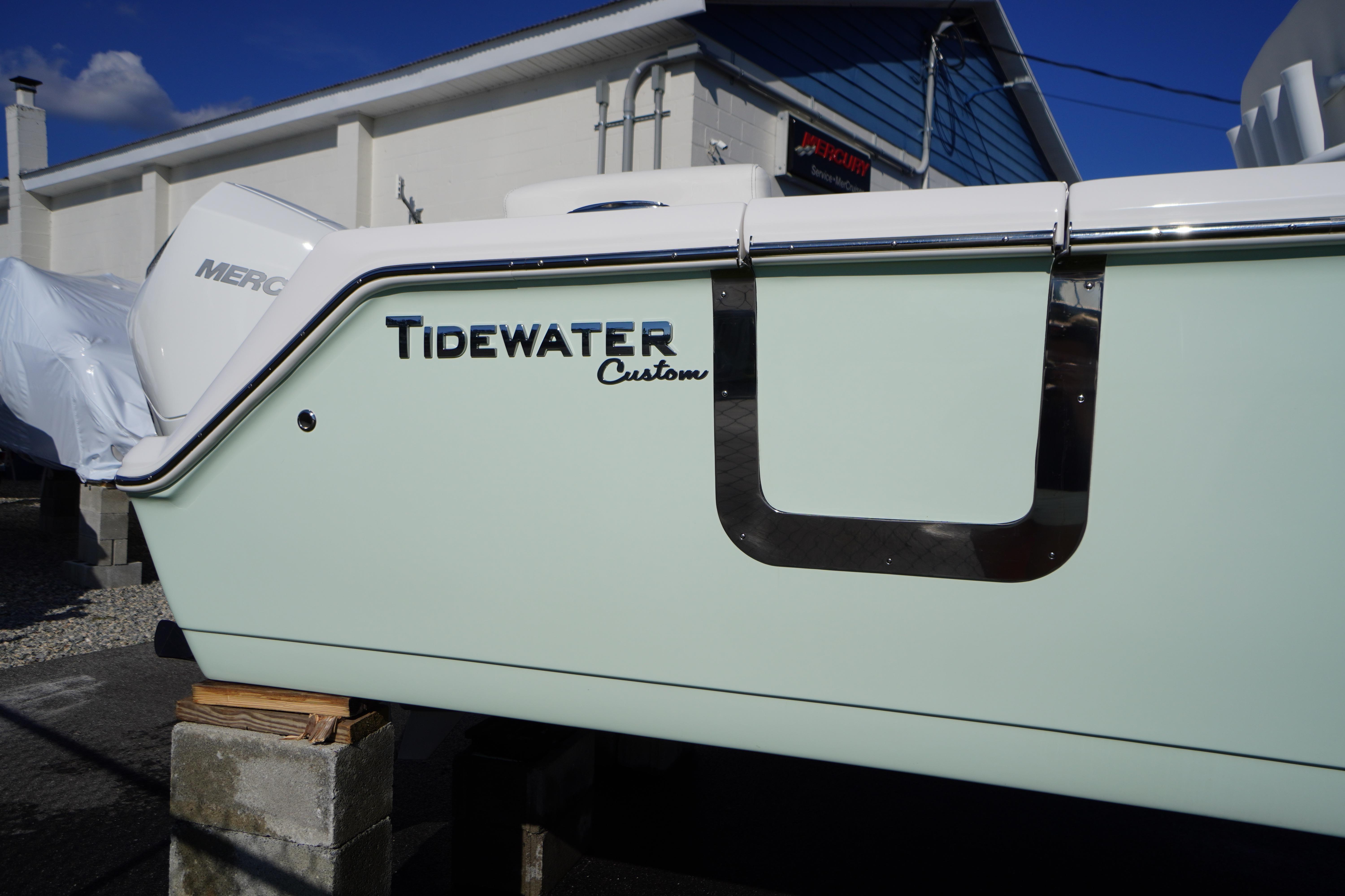 2026 Tidewater 272 LXF boat with custom design, displayed outdoors.