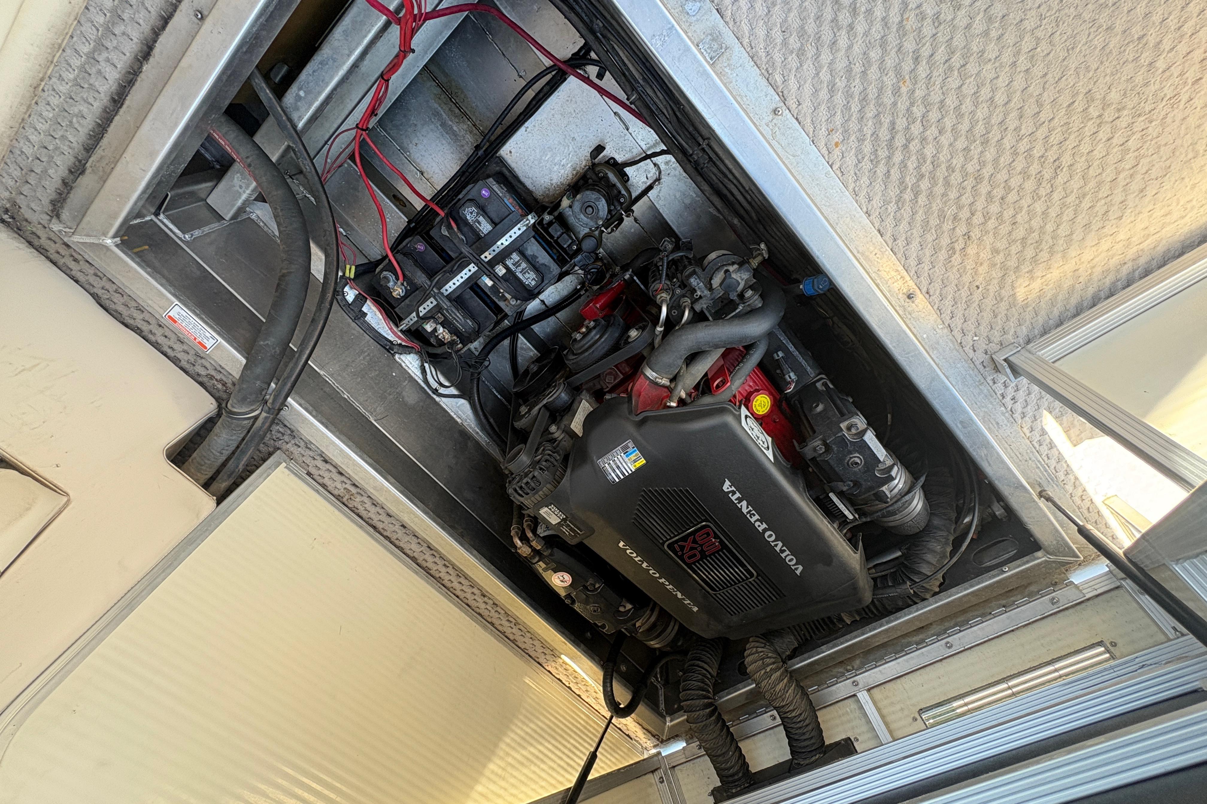 Engine compartment of a 2005 Bennington 2575RFS I/O boat with Volvo Penta engine.