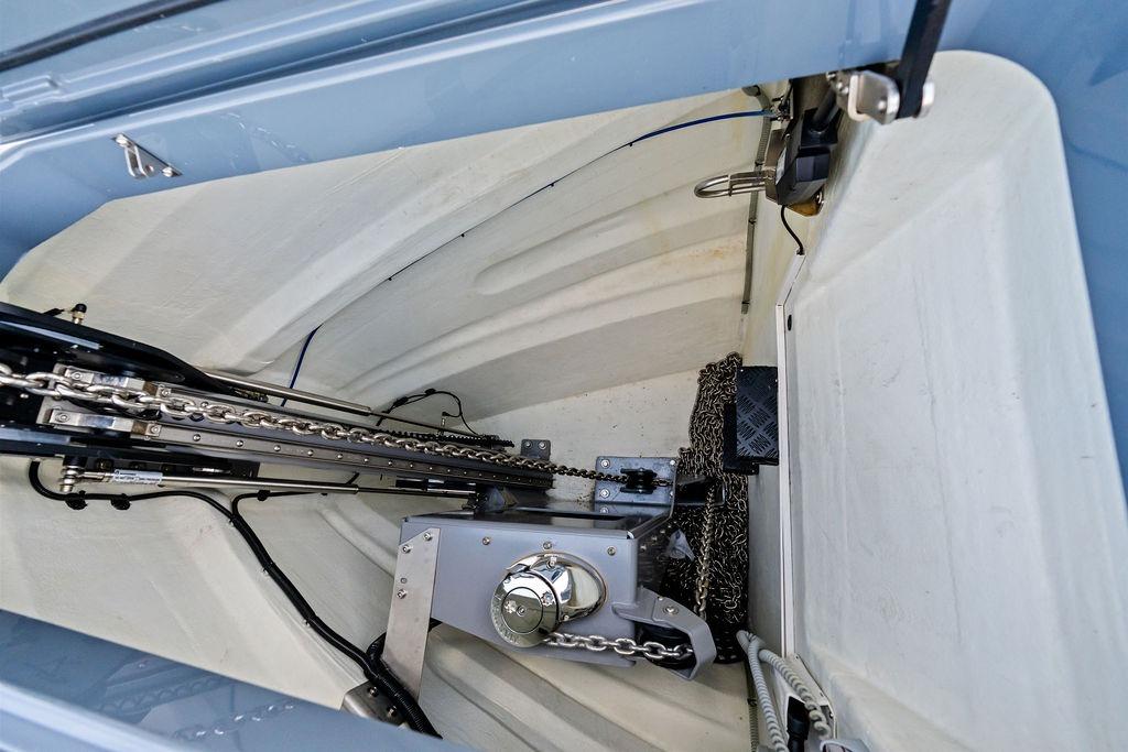 Anchor compartment of 2024 Vanquish Yachts VQ55, showcasing chain and mechanical components.